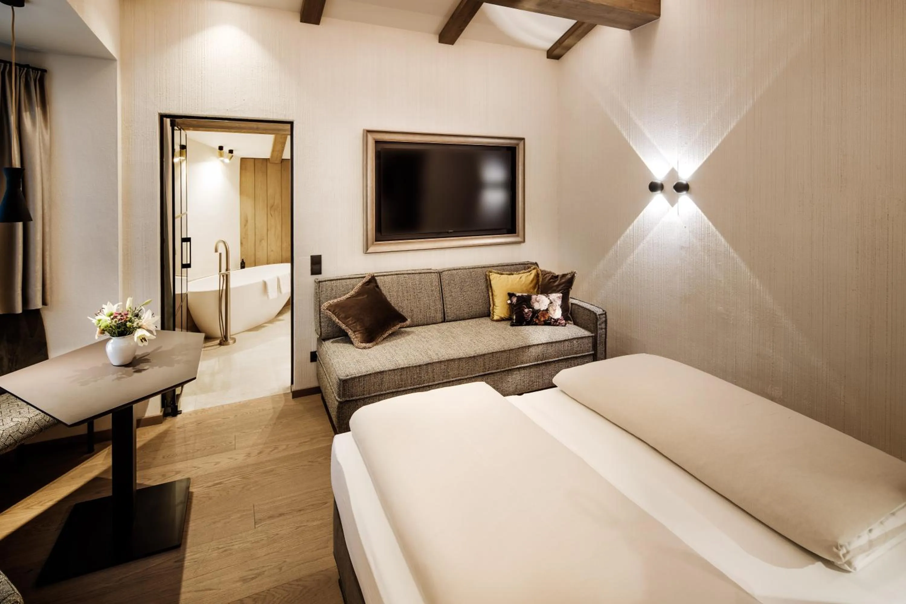 Photo of the whole room, Bed in Brugger's Genießerhotel Lanersbacherhof