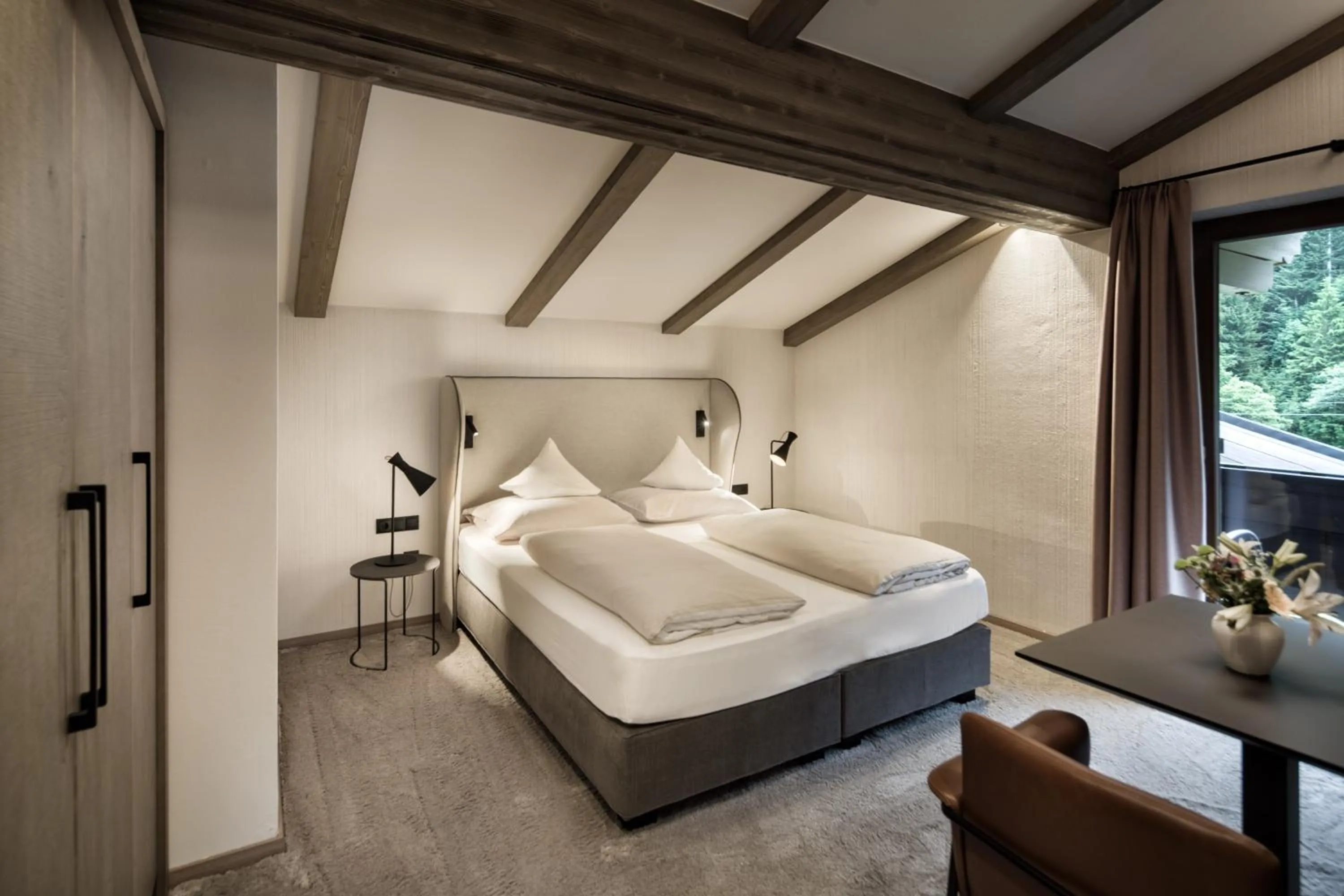 Photo of the whole room, Bed in Brugger's Genießerhotel Lanersbacherhof