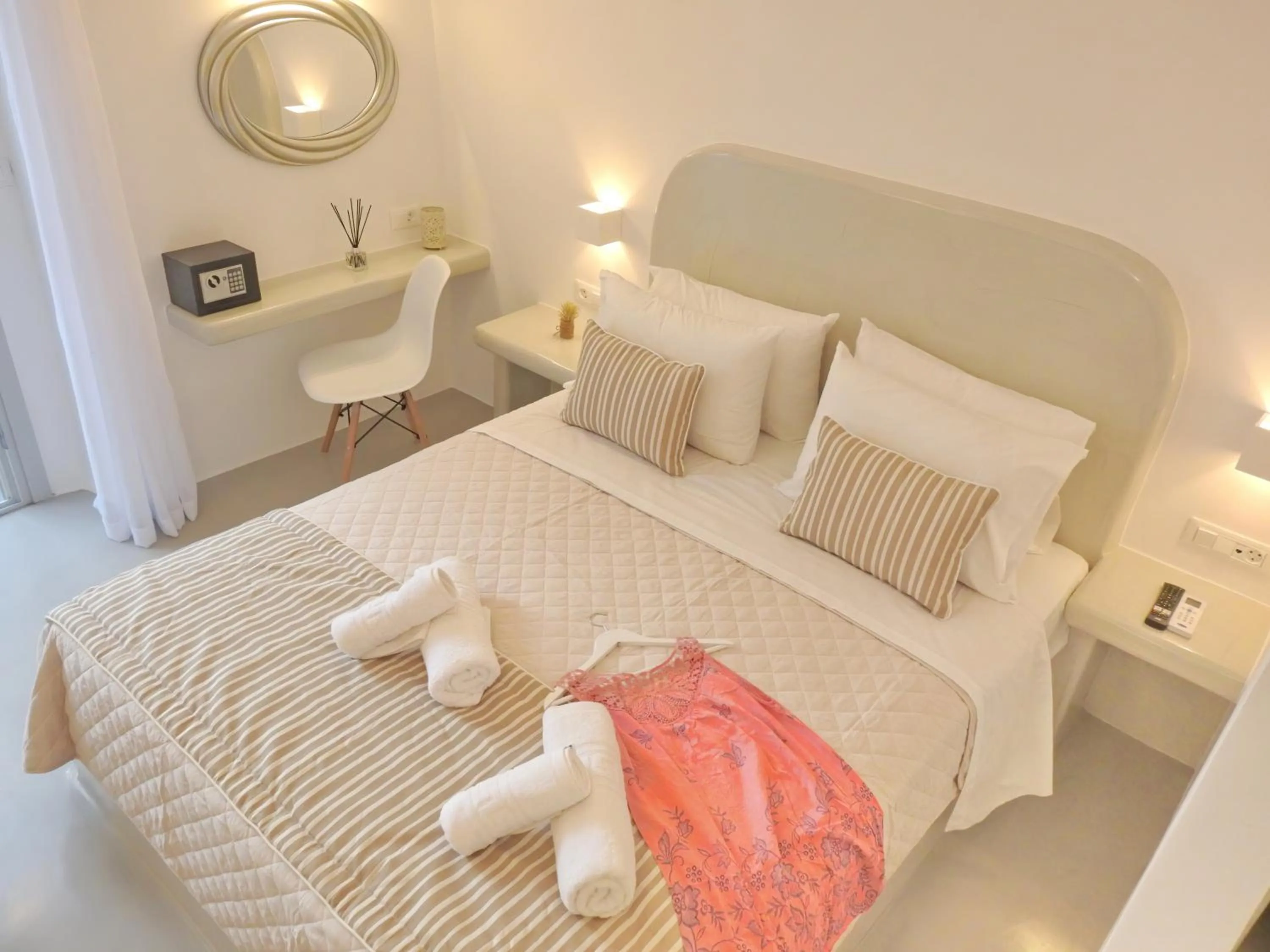 Bed in Golden Stone Santorini Suites