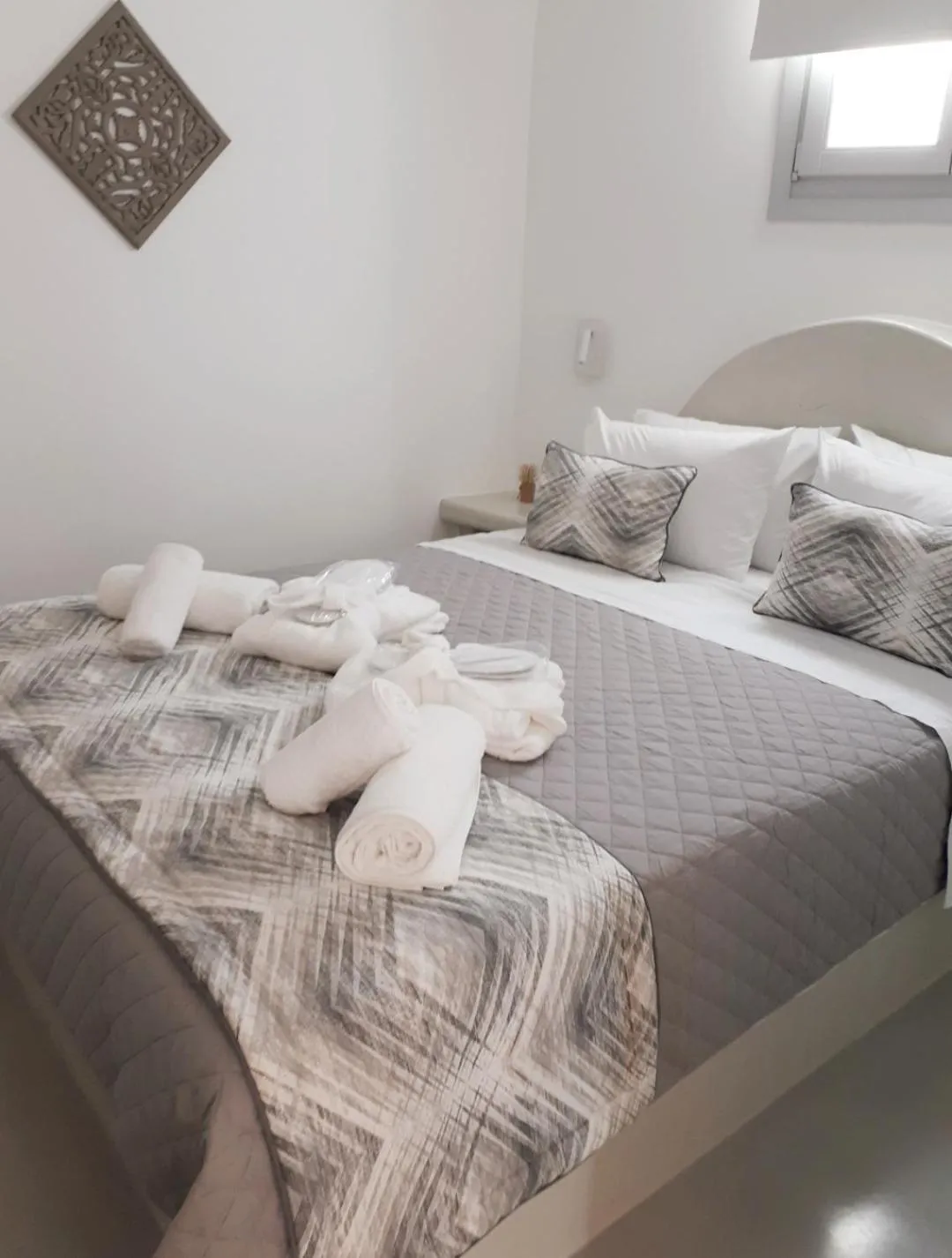 Bed in Golden Stone Santorini Suites