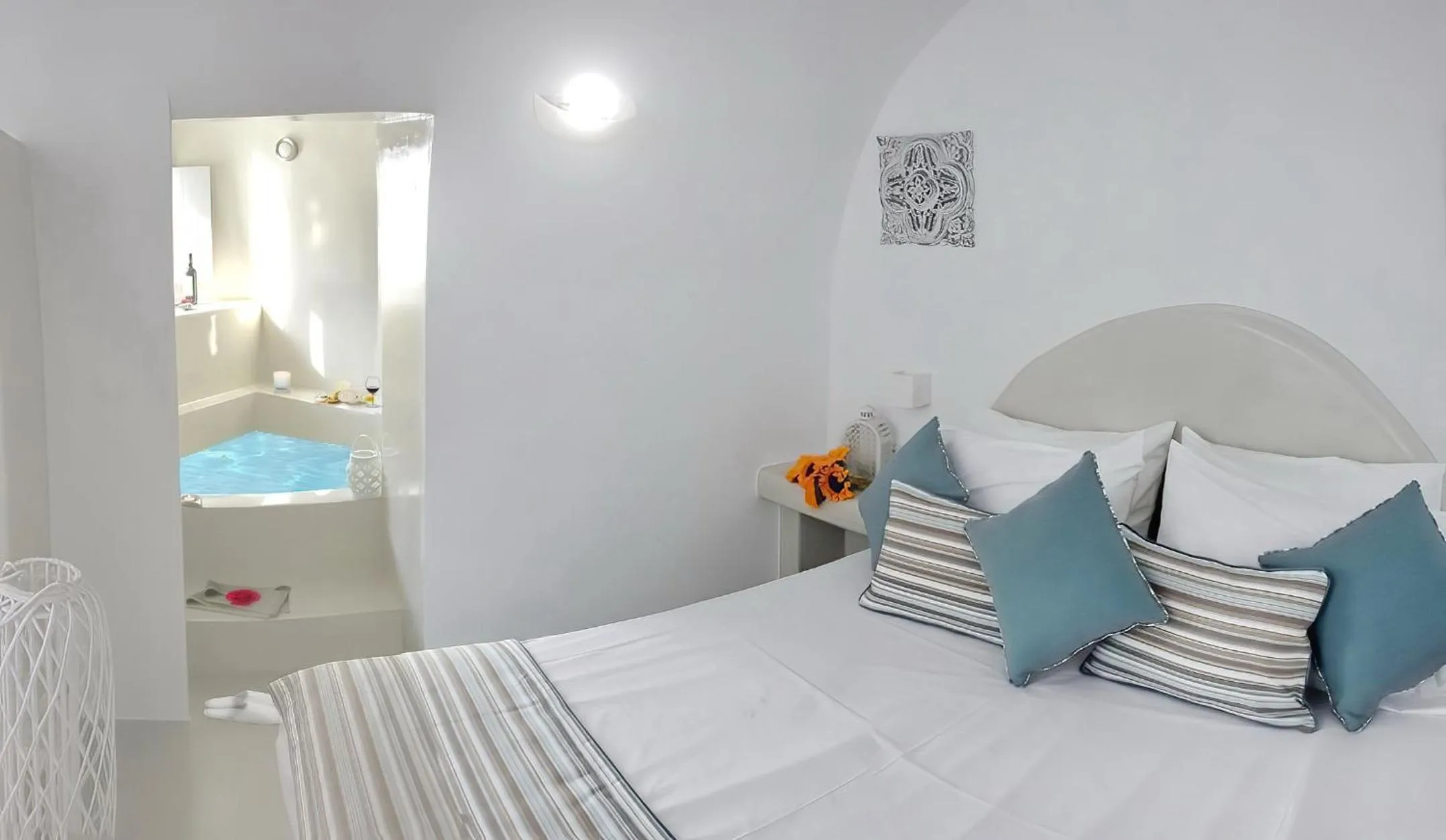 Bed in Golden Stone Santorini Suites