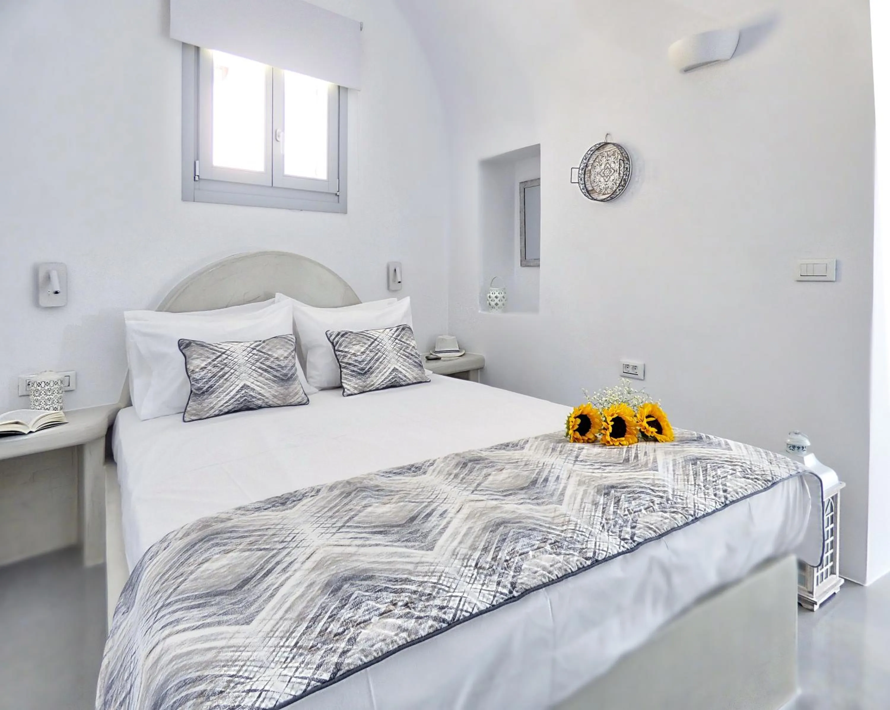 Bed in Golden Stone Santorini Suites