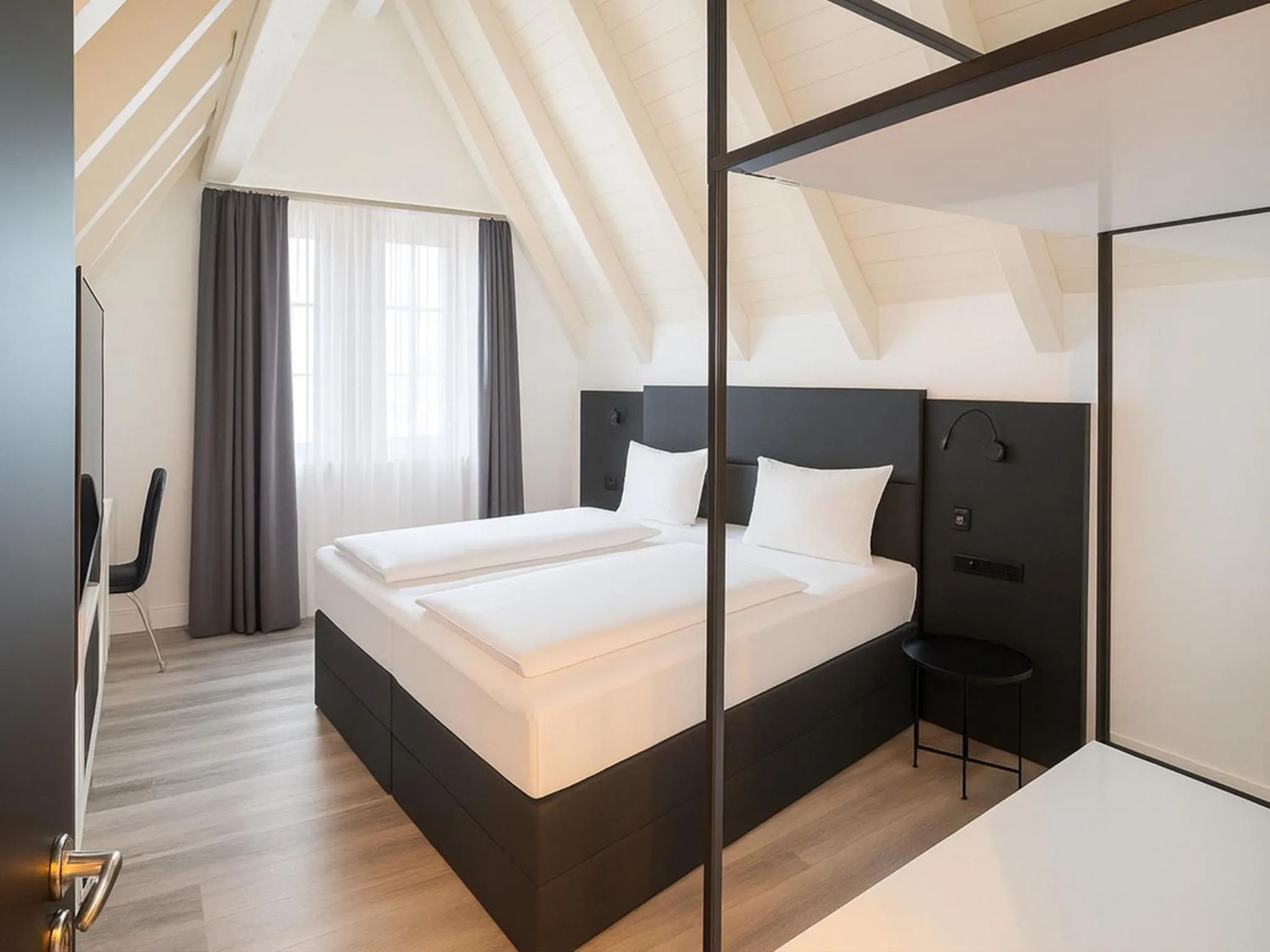 Photo of the whole room, Bed in DORMERO Hotel Schwäbisch Hall