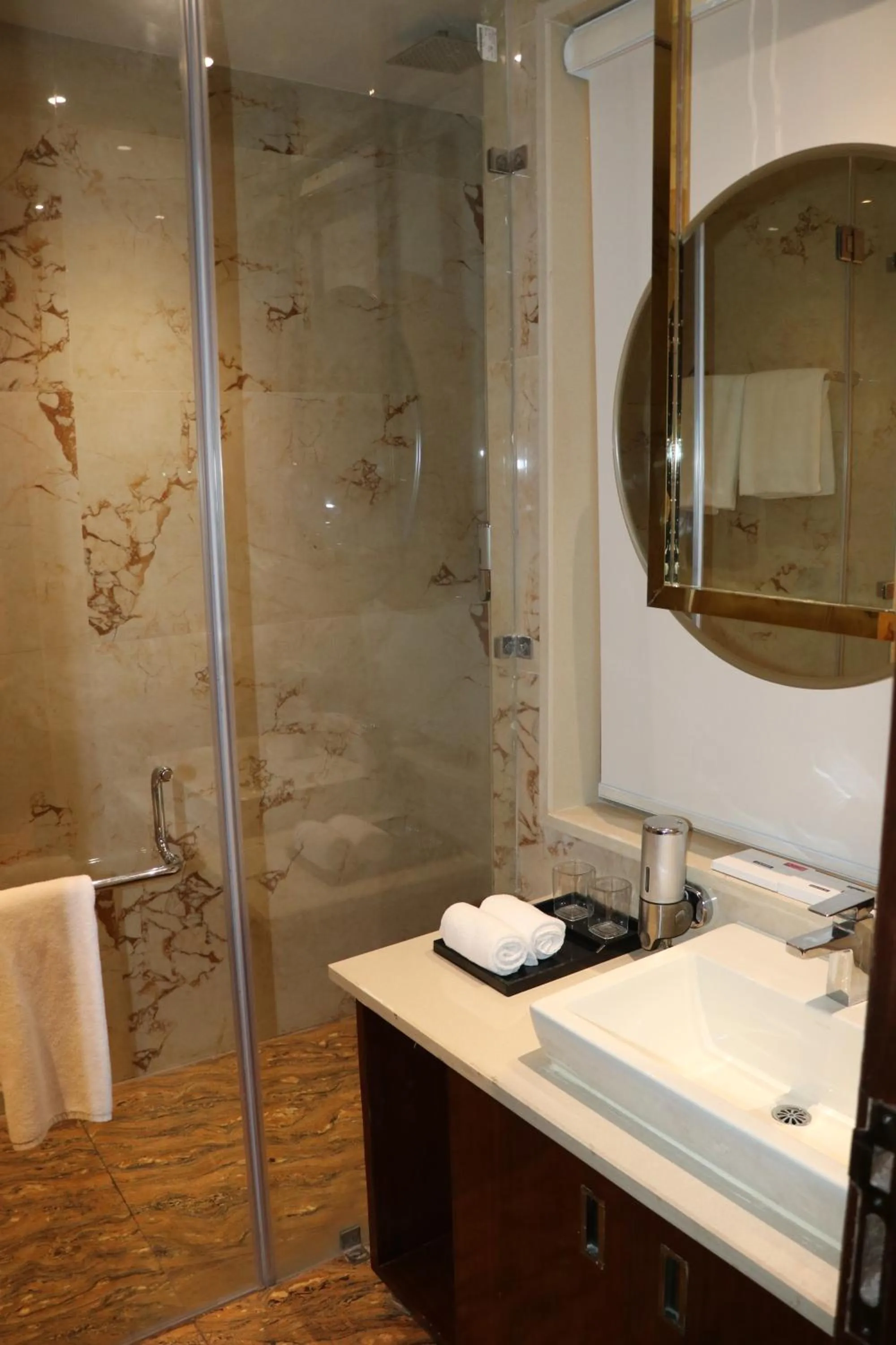 Bathroom in Regenta Inn Amristar Airport Road by Royal Orchid Hotels Limited