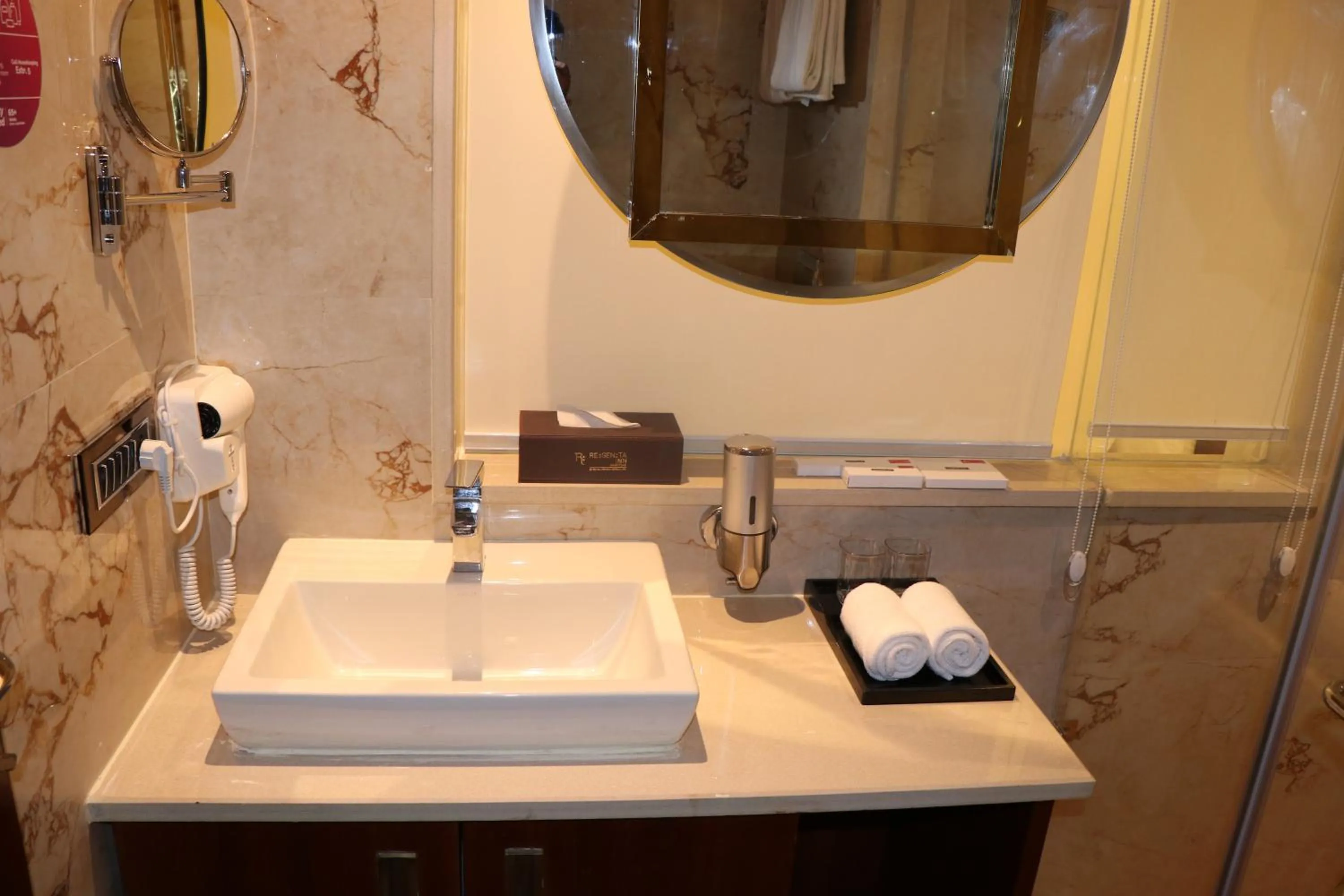 Bathroom in Regenta Inn Amristar Airport Road by Royal Orchid Hotels Limited
