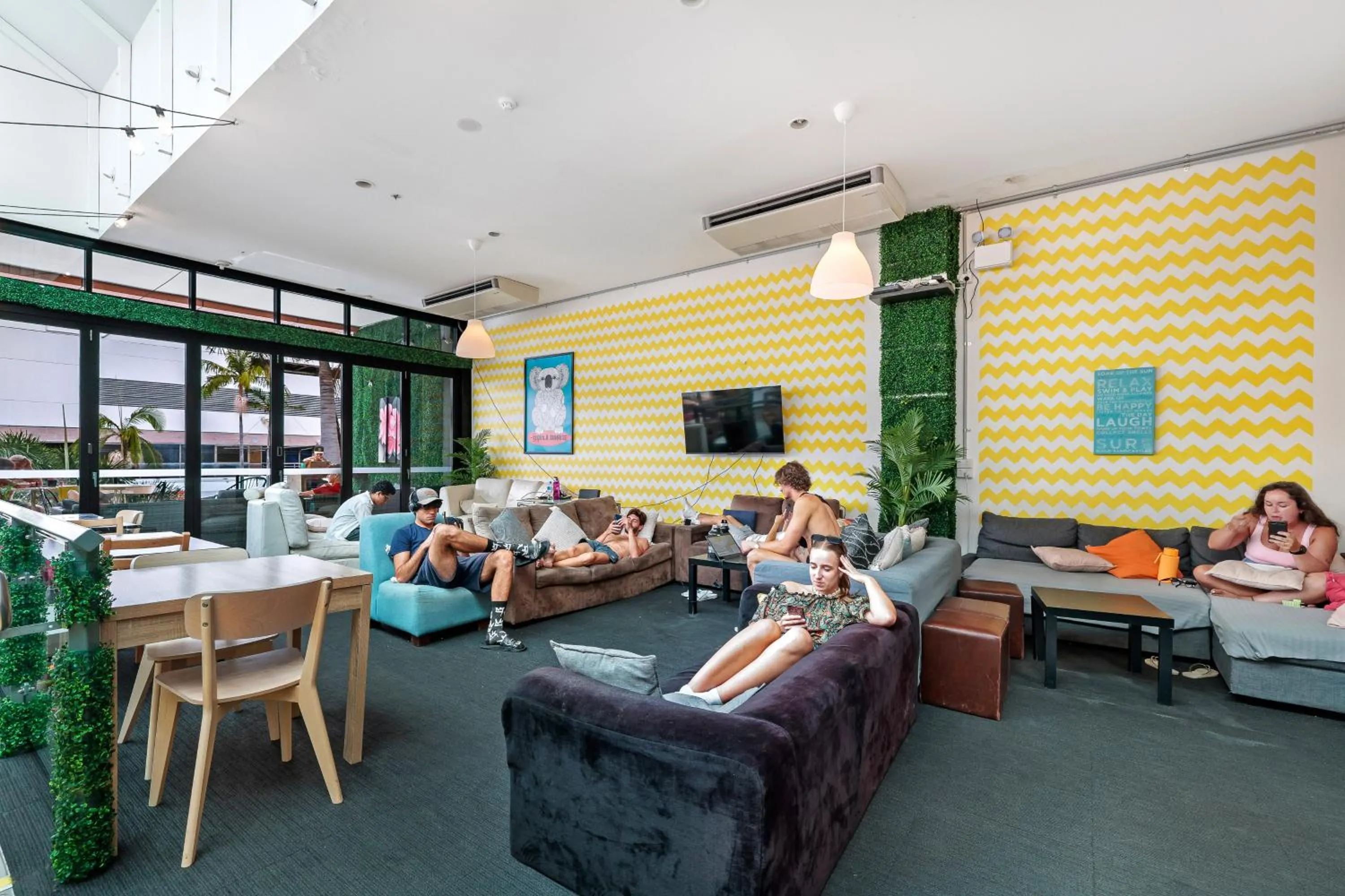Communal lounge/ TV room in Tequila Sunrise Hostel Surfers Paradise