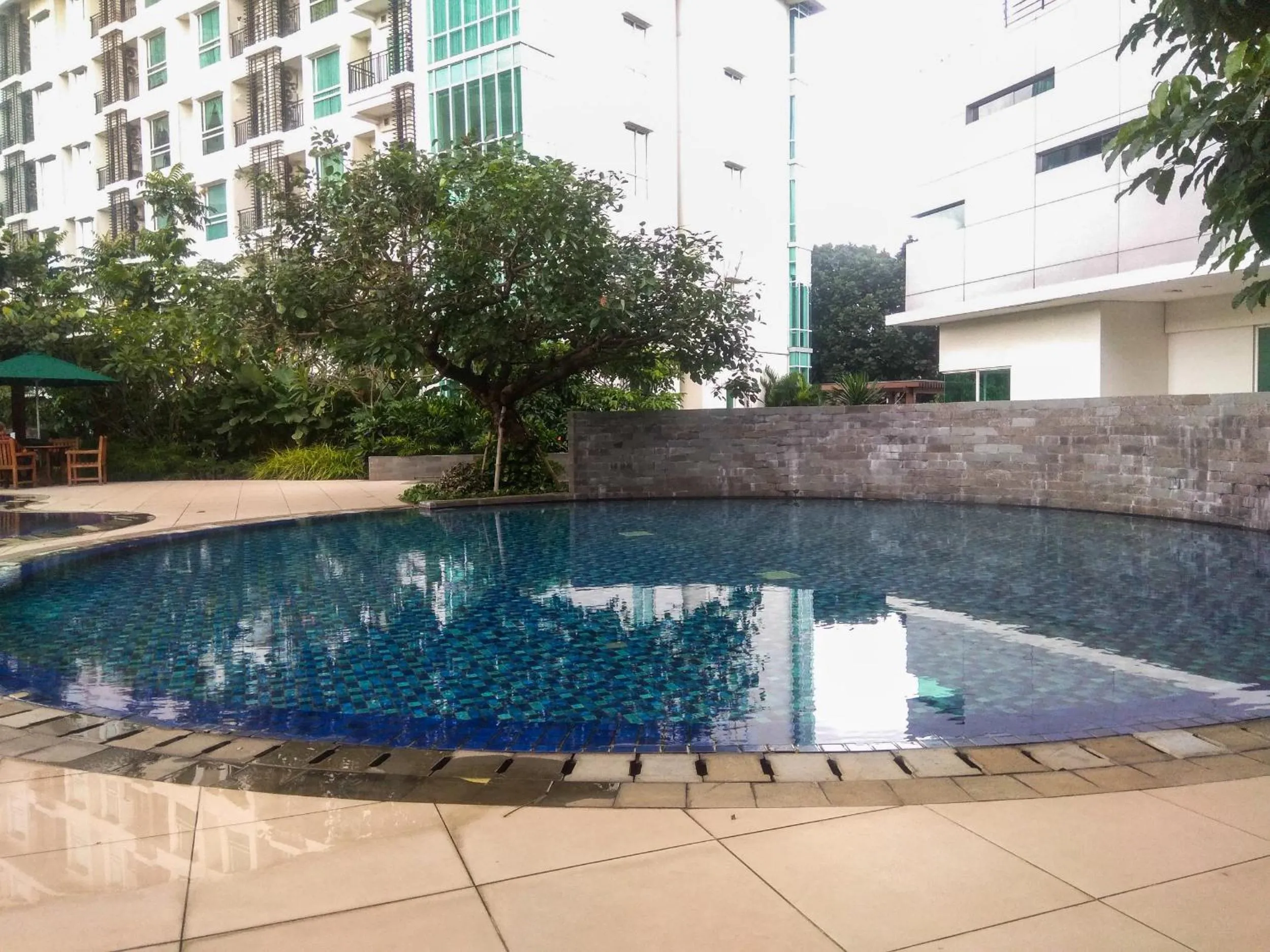 Property building in Fully Furnished Apartment with Comfortable Design 1BR Woodland Park Residence By Travelio