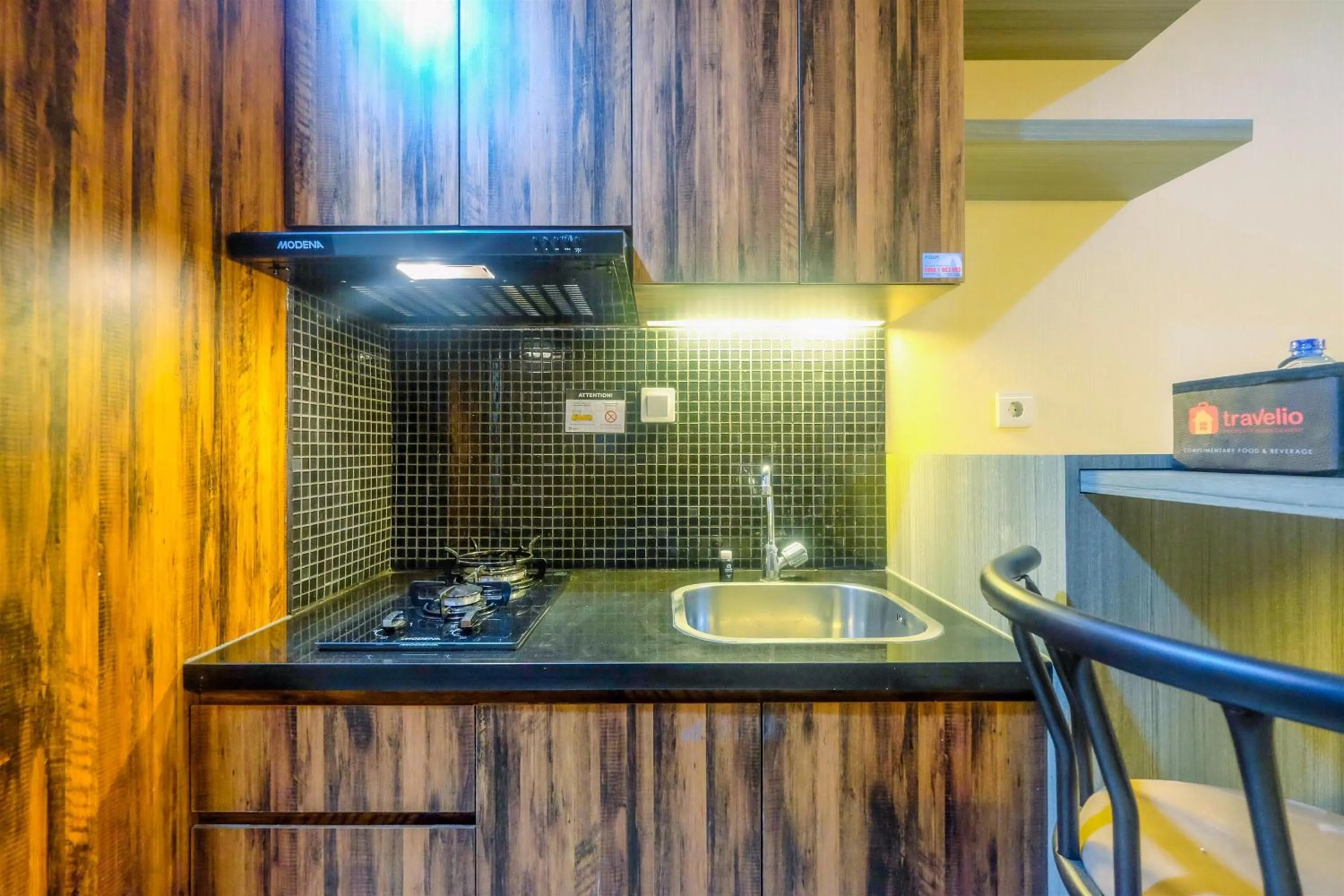Kitchen or kitchenette in Fully Furnished Apartment with Comfortable Design 1BR Woodland Park Residence By Travelio