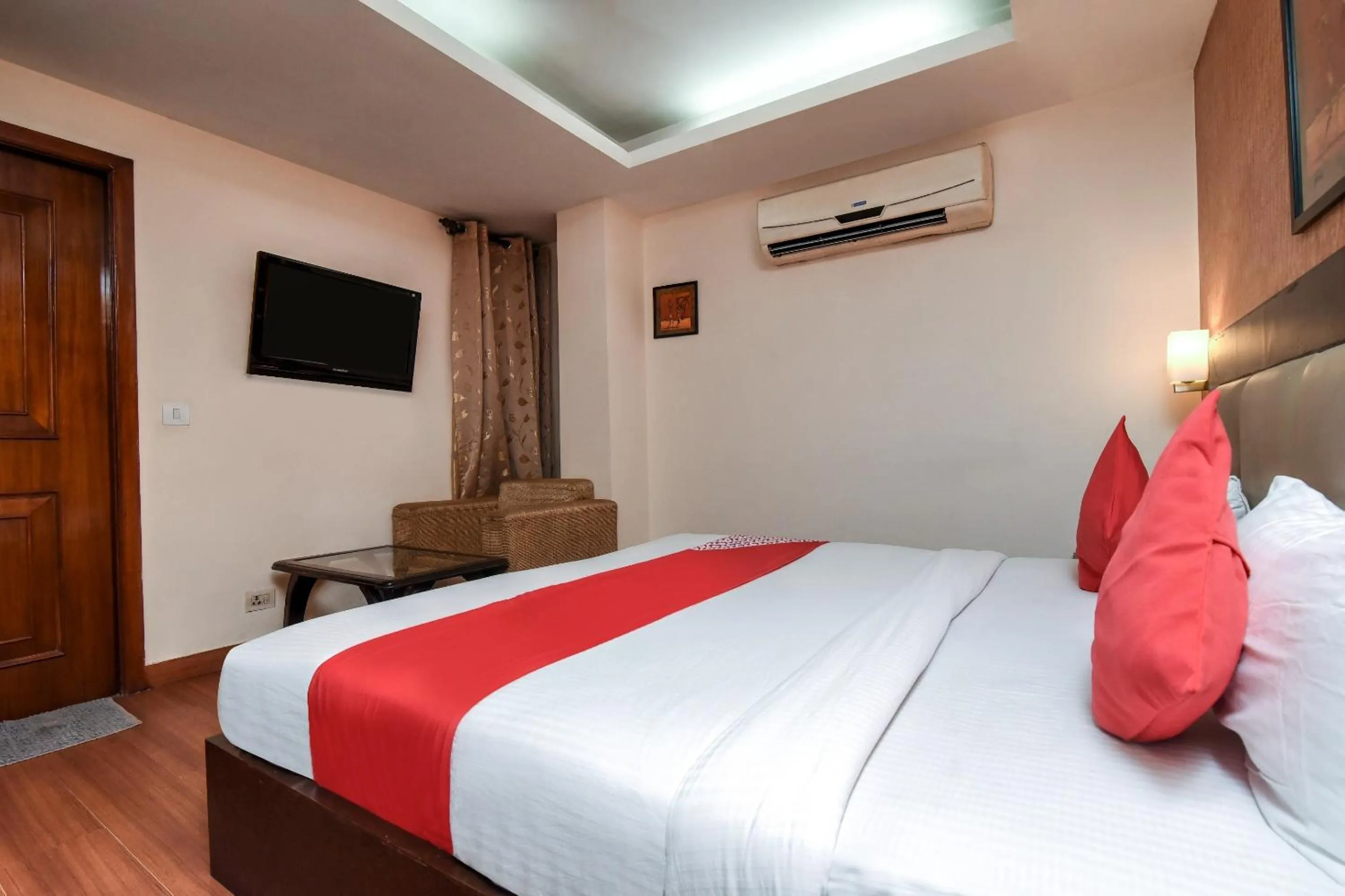 Bedroom in Capital O Corporate Inn