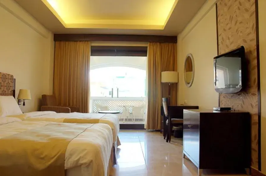 TV and multimedia, Bed in Pramod Convention & Club Resort TV and multimedia, Bed in Pramod Convention & Club Resort