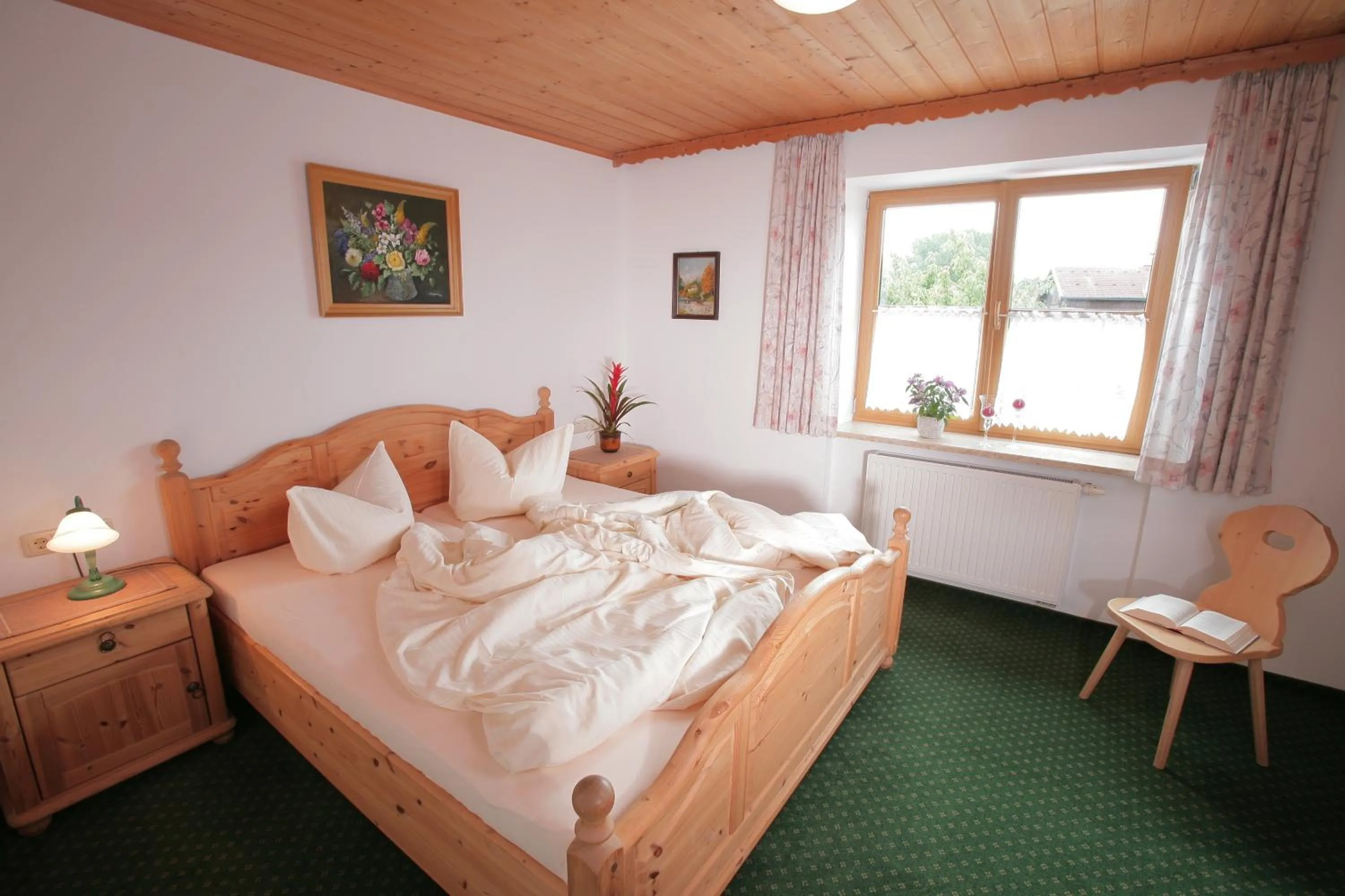 Bed in Pension Schweizerhaus Garni