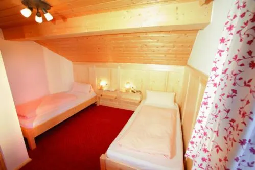 Photo of the whole room, Bed in Pension Schweizerhaus Garni