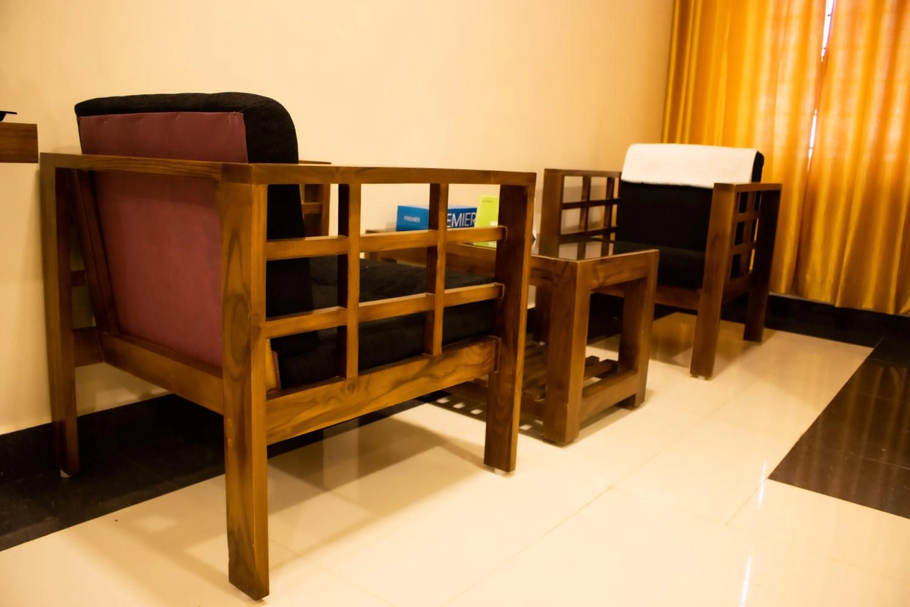 Seating area, Bed in Faiz Residency