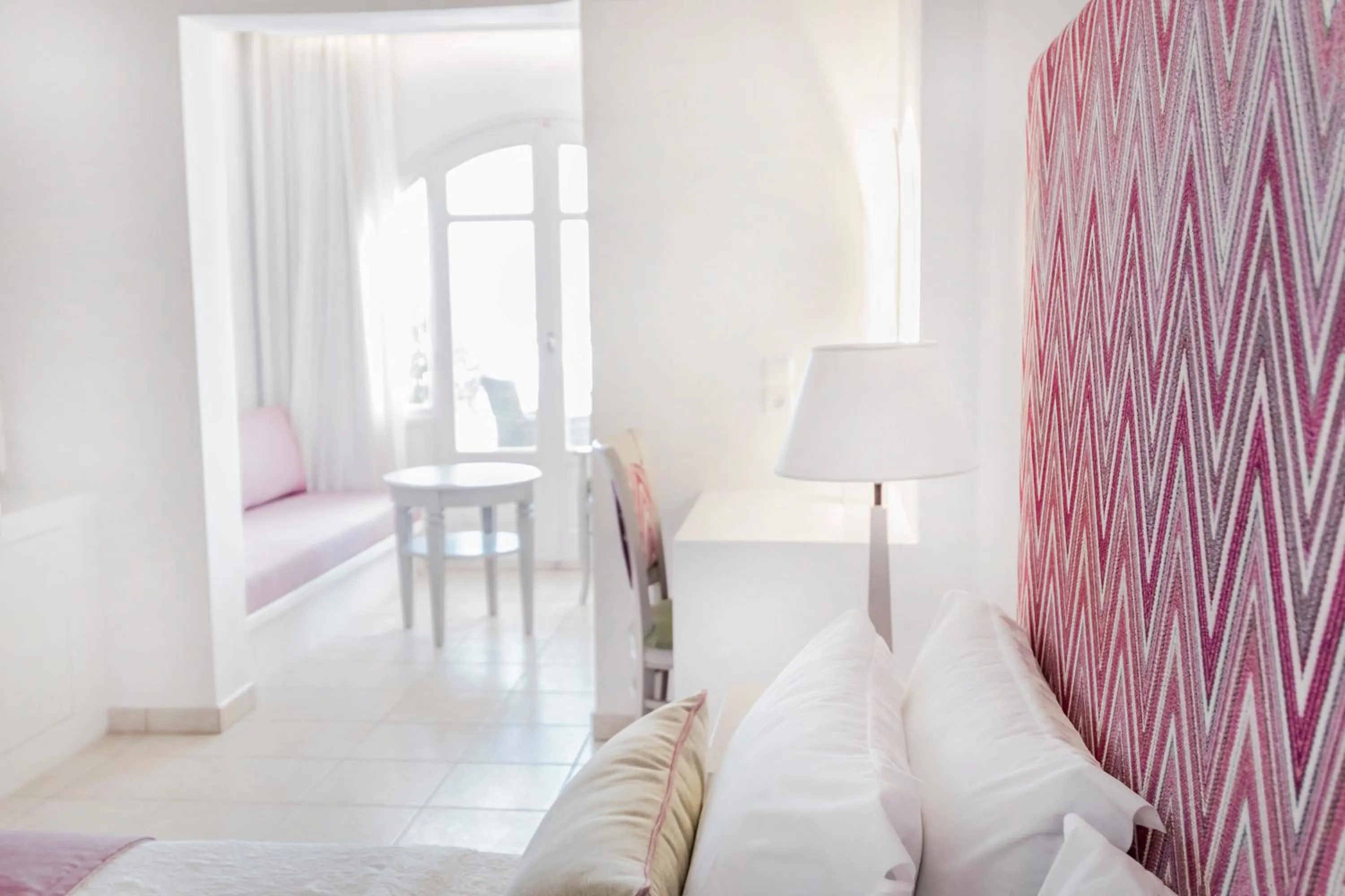 Bed in Stelia Mare Boutique Hotel