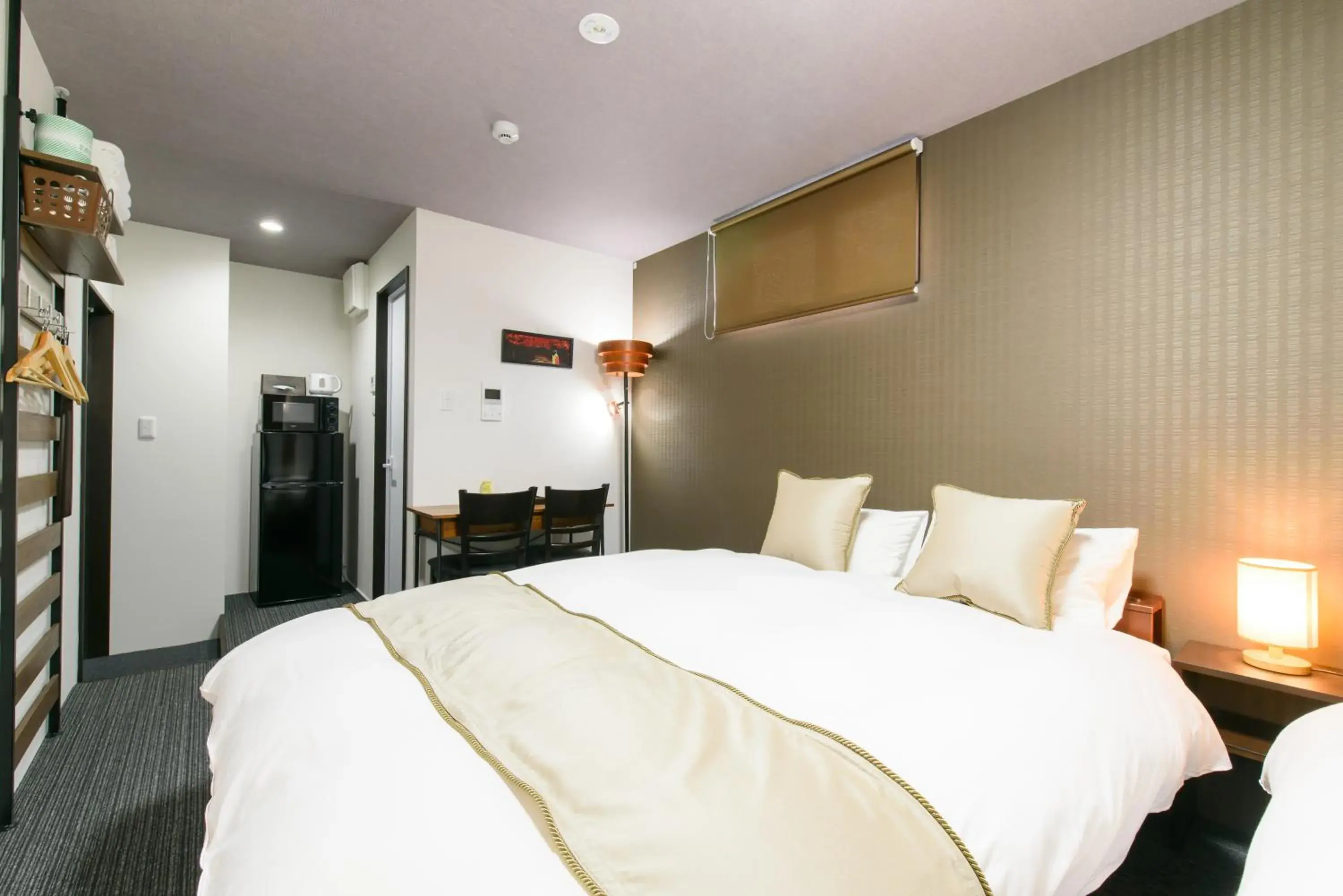 Bed in JP INN Kyotoeki Kita Gakurincho Bed in JP INN Kyotoeki Kita Gakurincho