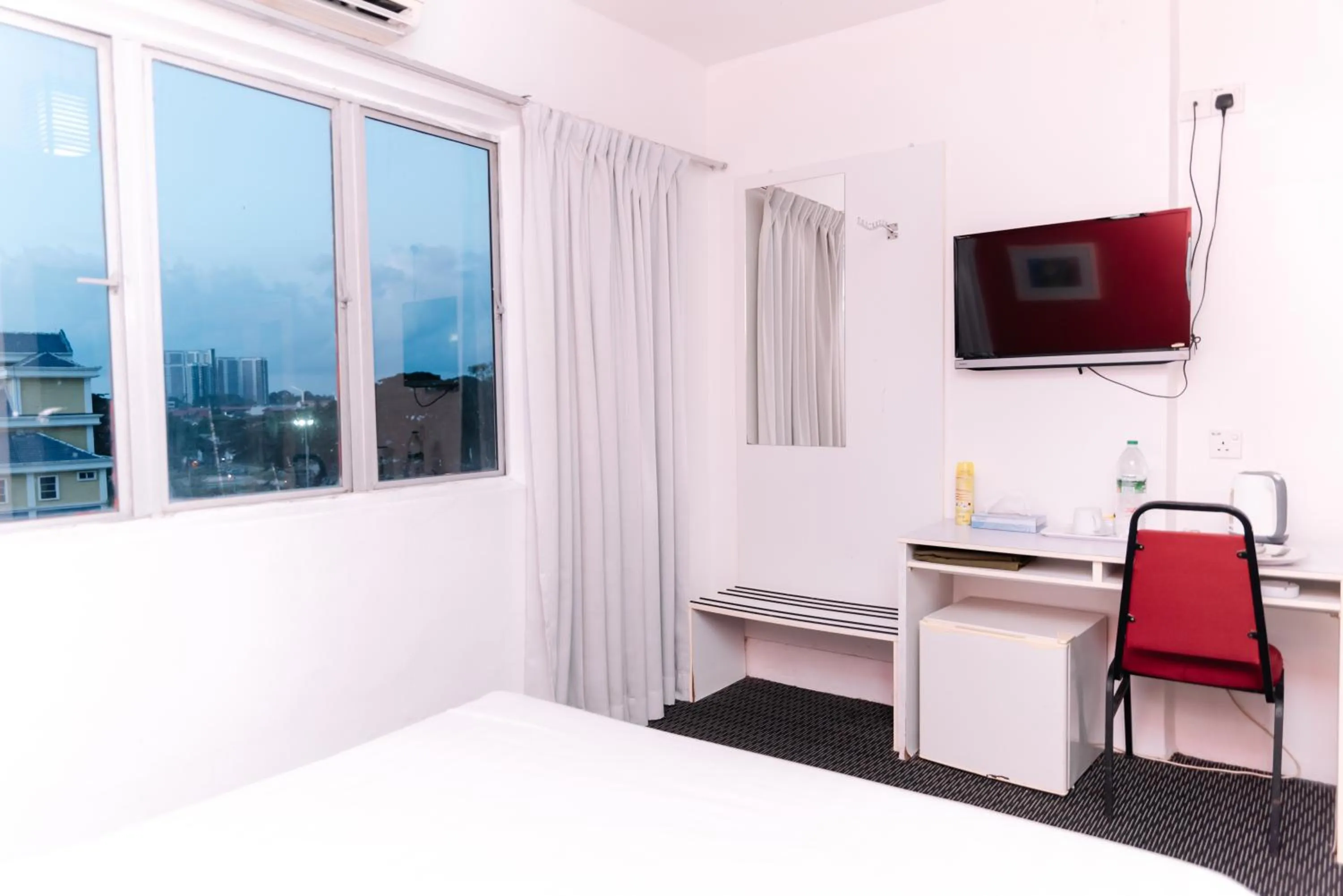 Seating area, Bed in Ridel Sunset Hotel