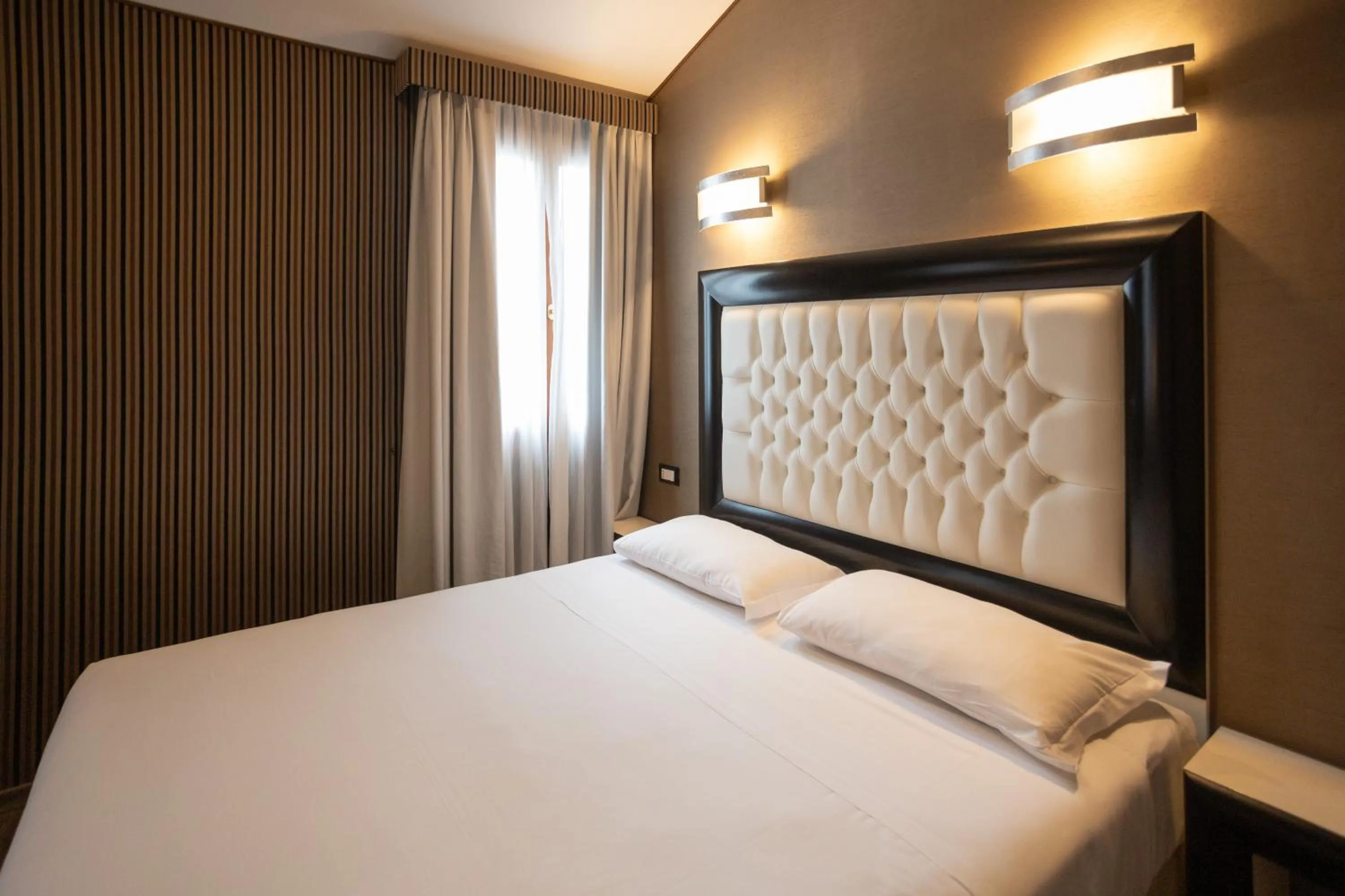 Bed in Duomo Boutique Hotel