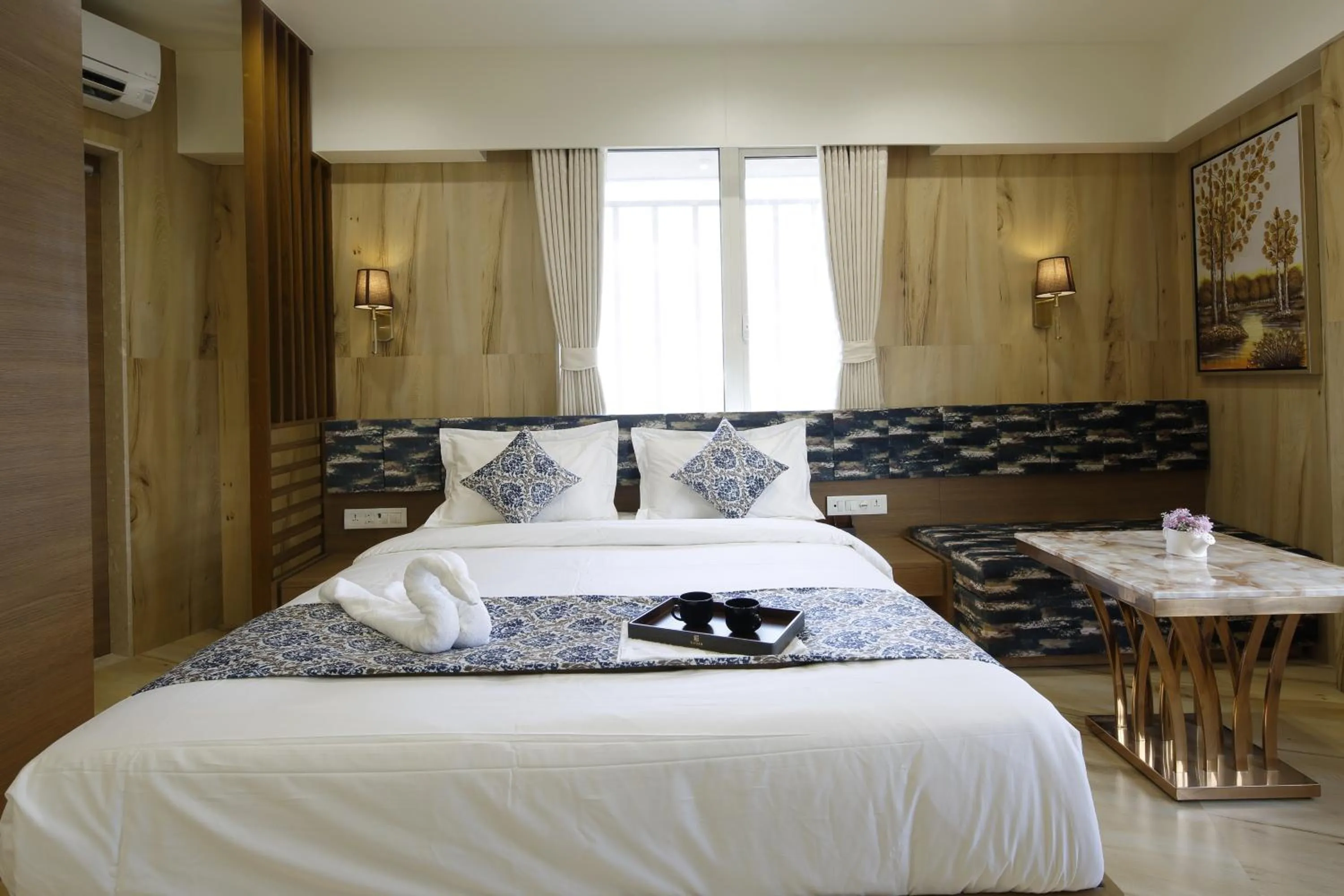 Bed in Hotel Elysian Residency