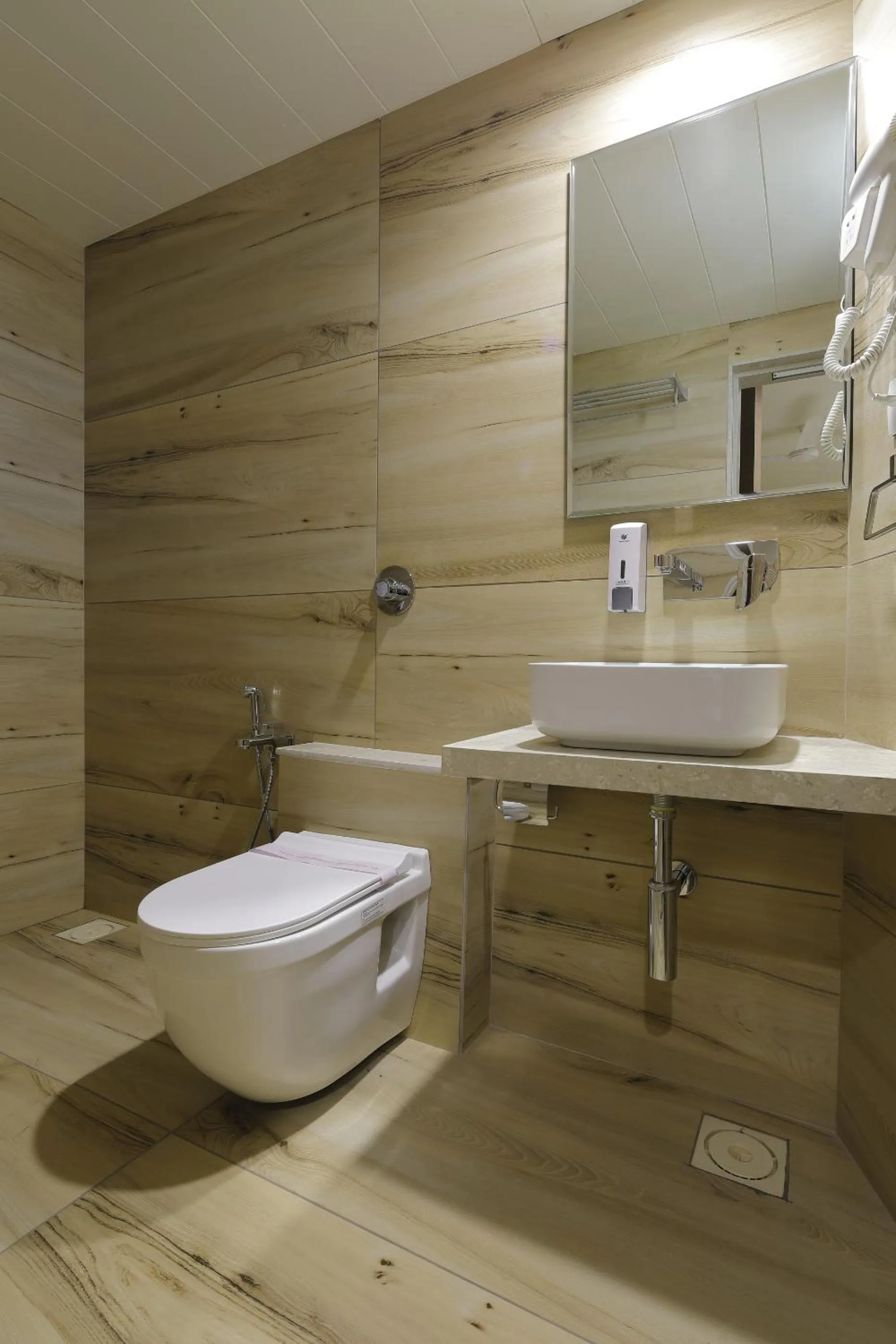 Bathroom in Hotel Elysian Residency