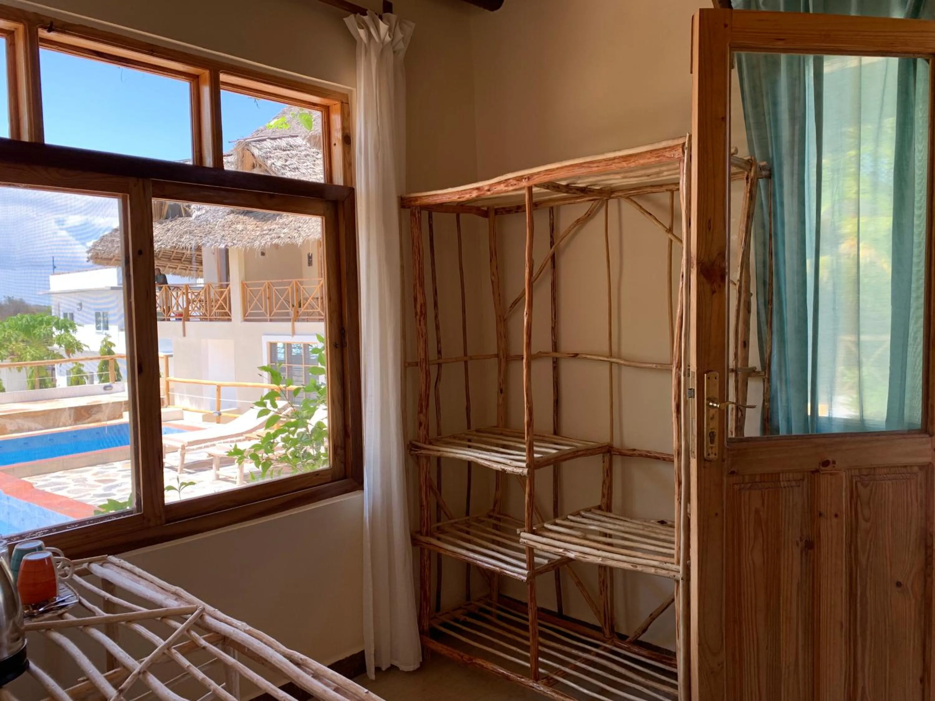 Pool view, Bed in Zanzibar Tropical Sunset Boutique Hotel - Adults Only