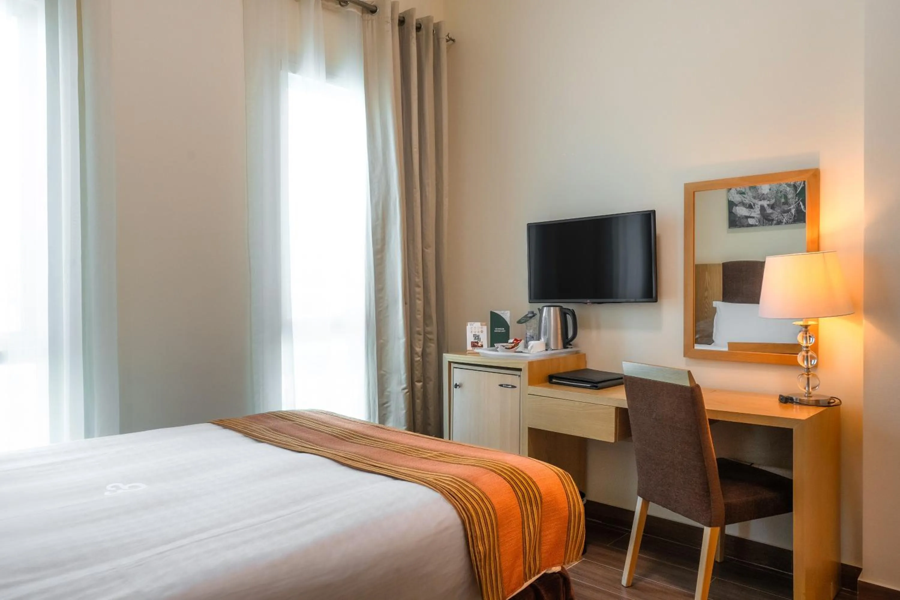 Photo of the whole room, Bed in Tamani Marina Hotel & Apartments