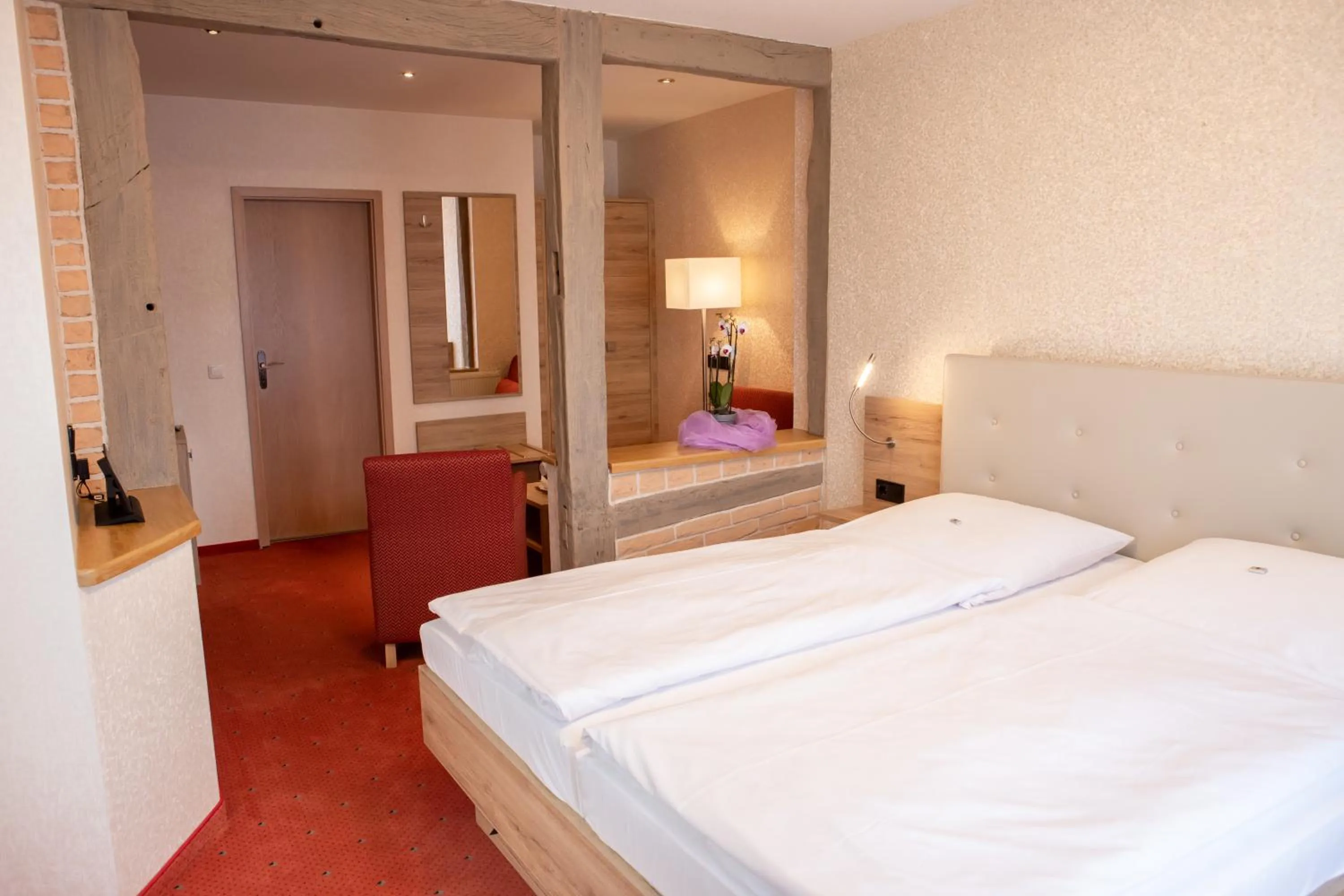 Bed in Flair Hotel Deutsches Haus