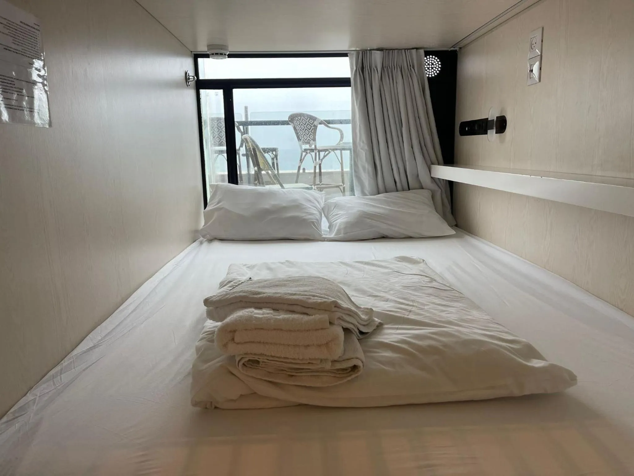 View (from property/room), Bed in The O Pod Capsule Hotel