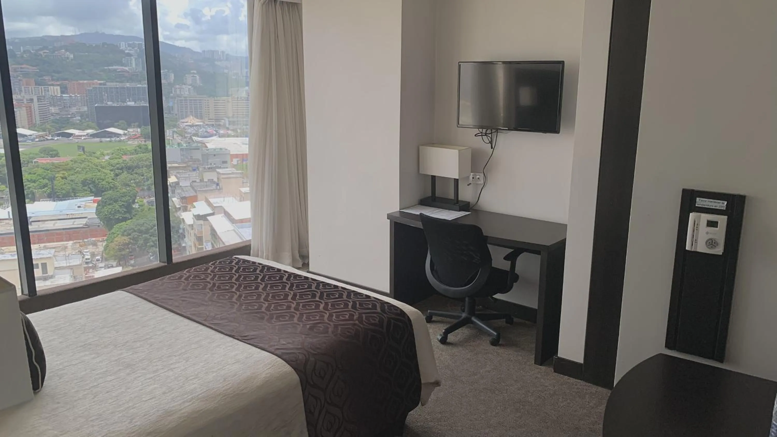 Photo of the whole room, Bed in HOTEL CHACAO SUITES