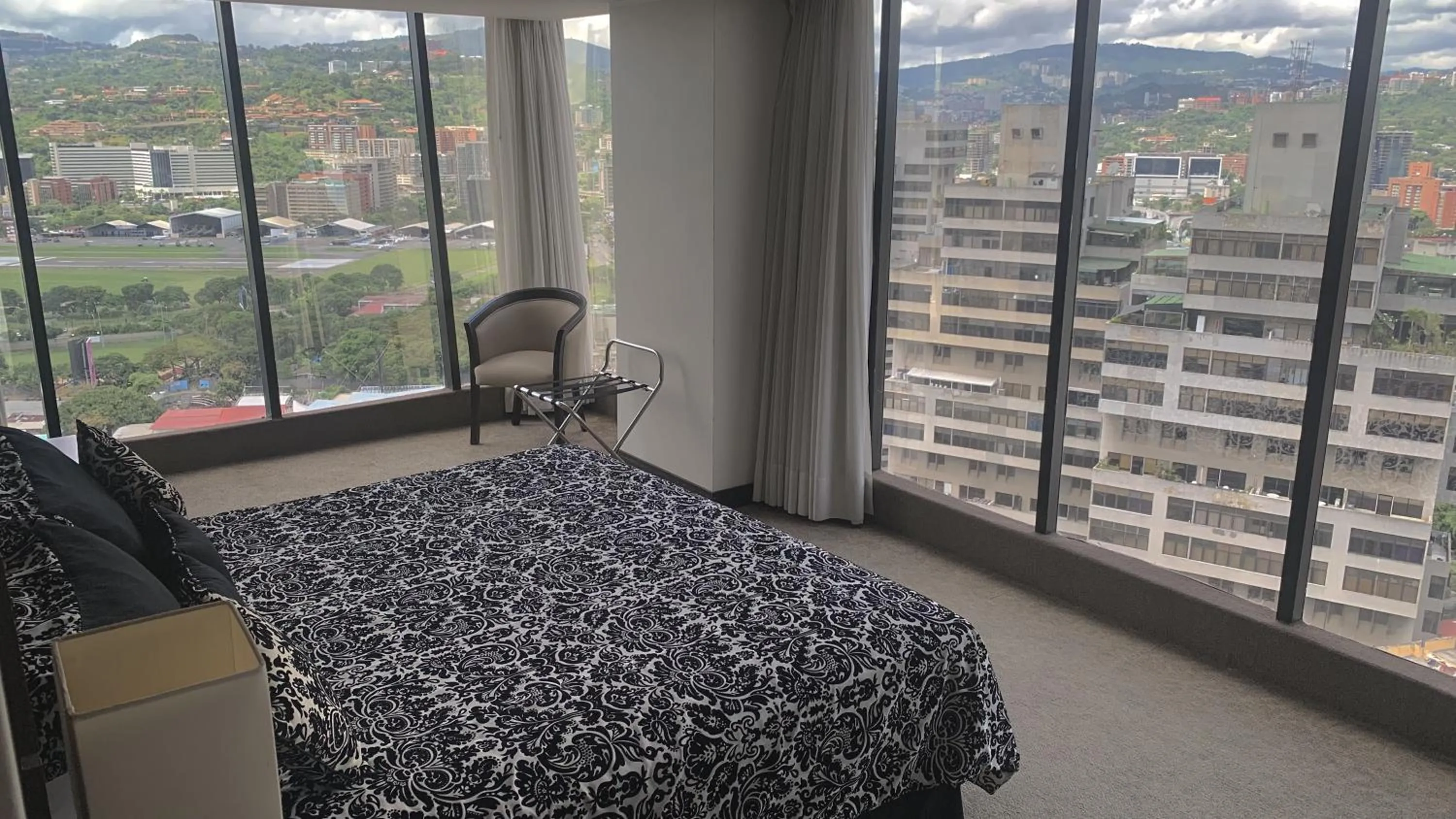 Bed in HOTEL CHACAO SUITES