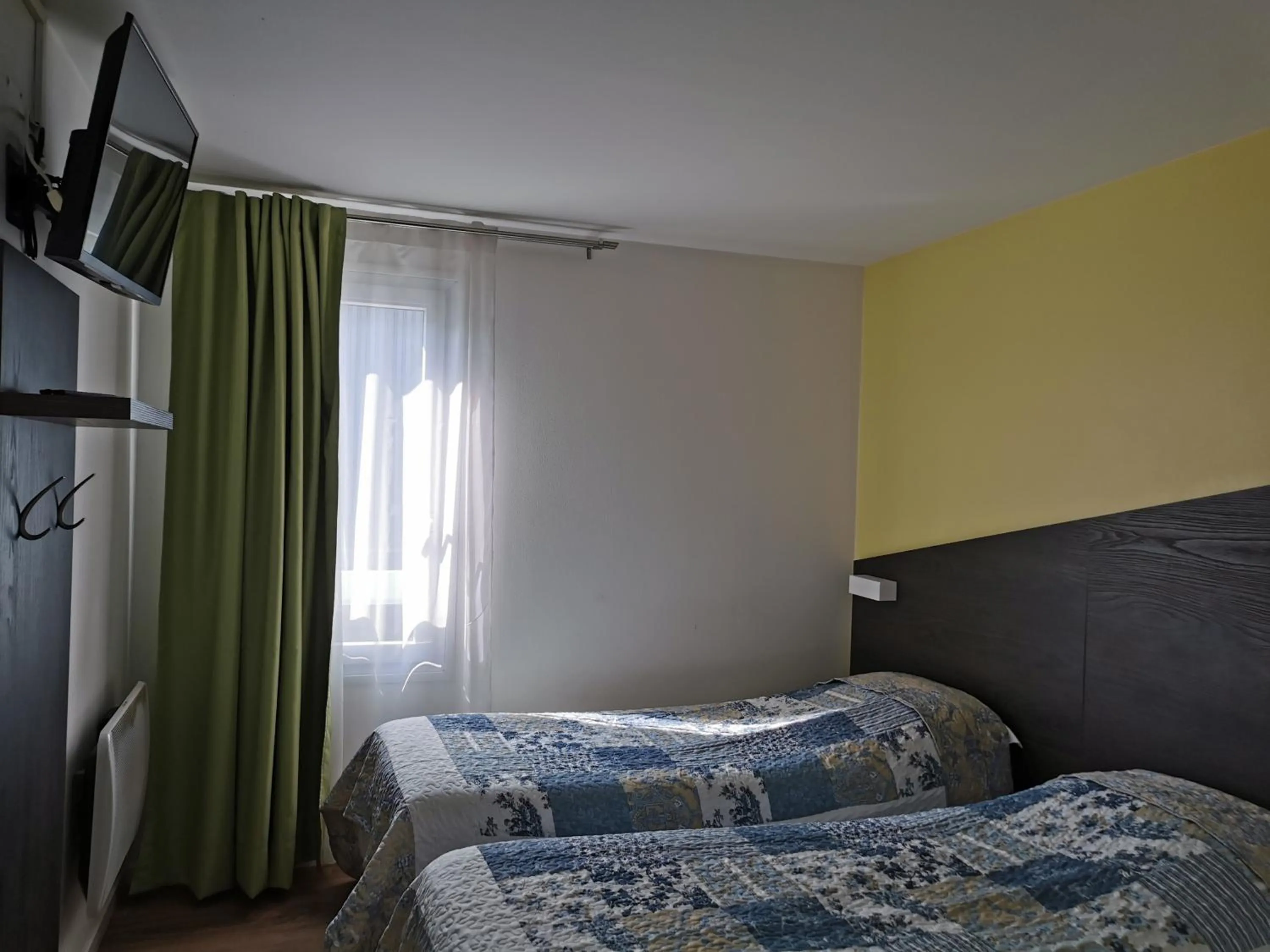 Photo of the whole room, Bed in FASTHOTEL PARIS OUEST BOUAFLE