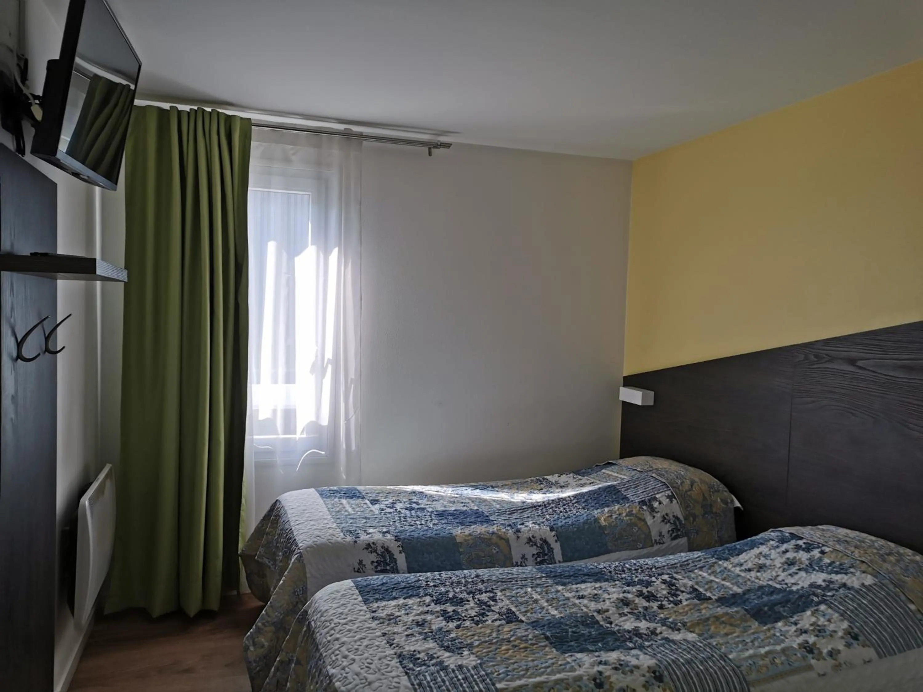 Photo of the whole room, Bed in FASTHOTEL PARIS OUEST BOUAFLE