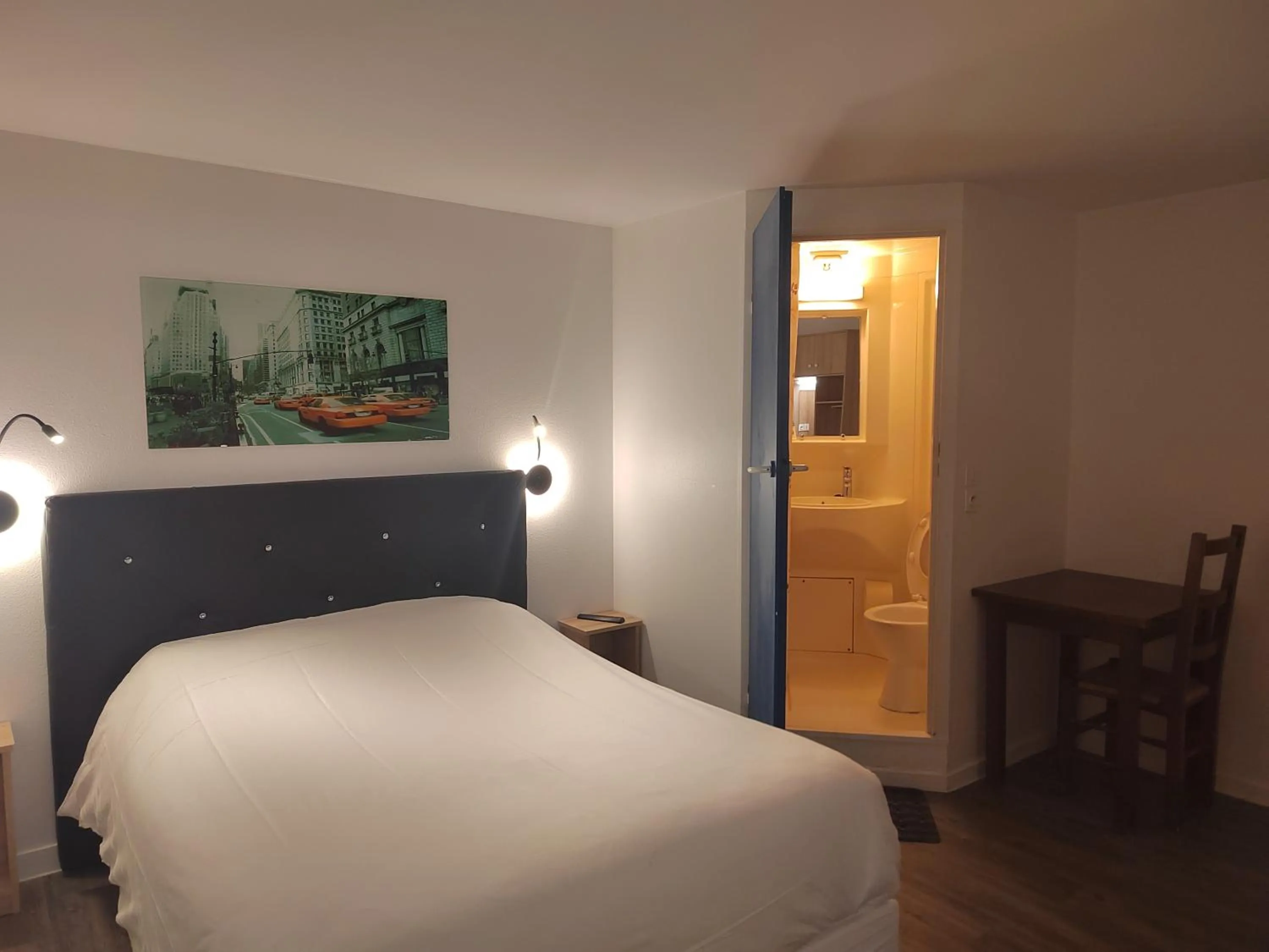 Photo of the whole room, Bed in FASTHOTEL PARIS OUEST BOUAFLE