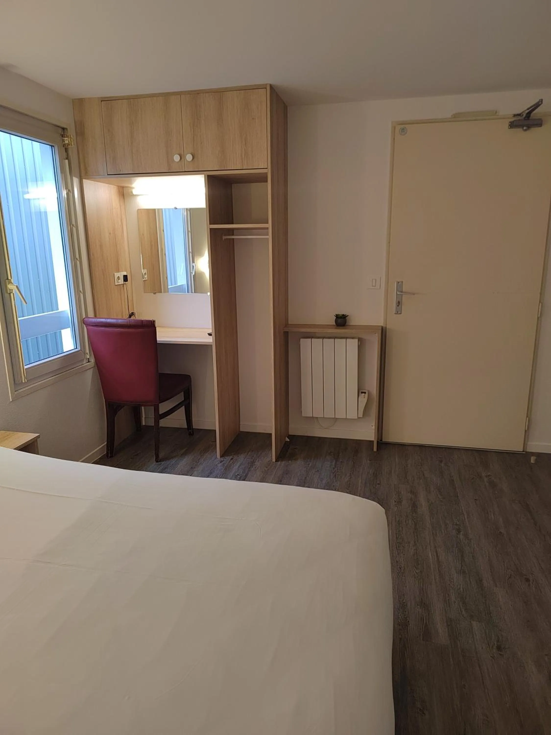 Photo of the whole room, Bed in FASTHOTEL PARIS OUEST BOUAFLE