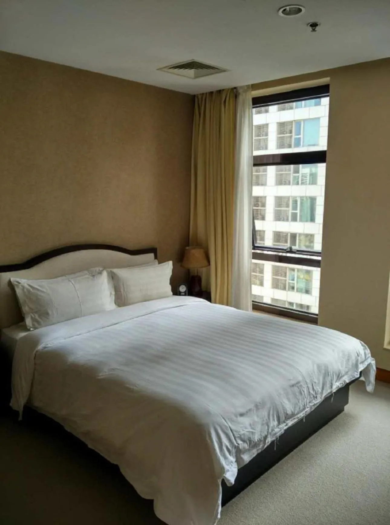 Bed in Dalian Asia Pacific Service Apartment (Former Somerset Harbour Court Dalian)