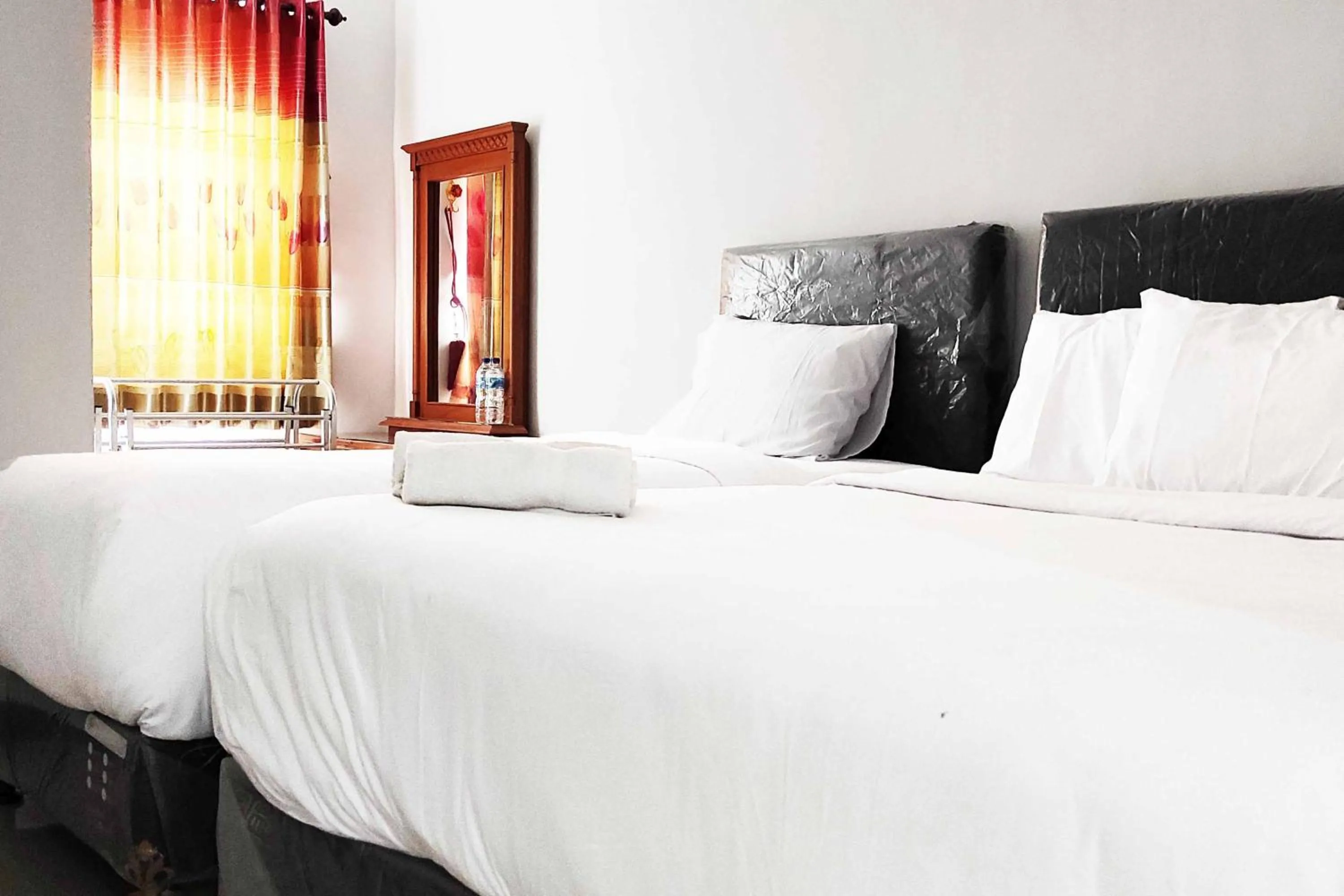 Bed in Pertiwi Homestay Near Museum Angkut Batu Mitra RedDoorz