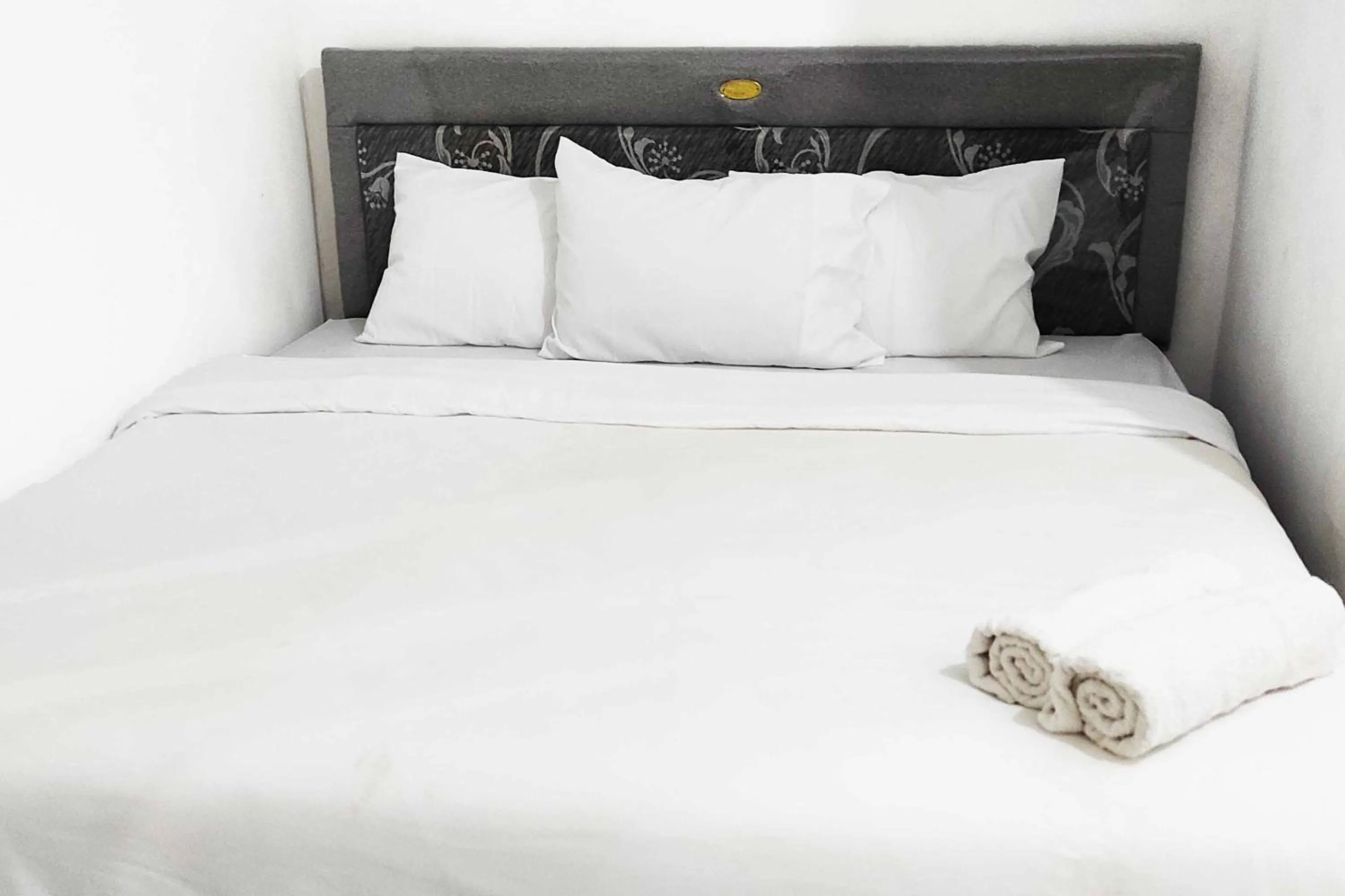 Bed in Pertiwi Homestay Near Museum Angkut Batu Mitra RedDoorz