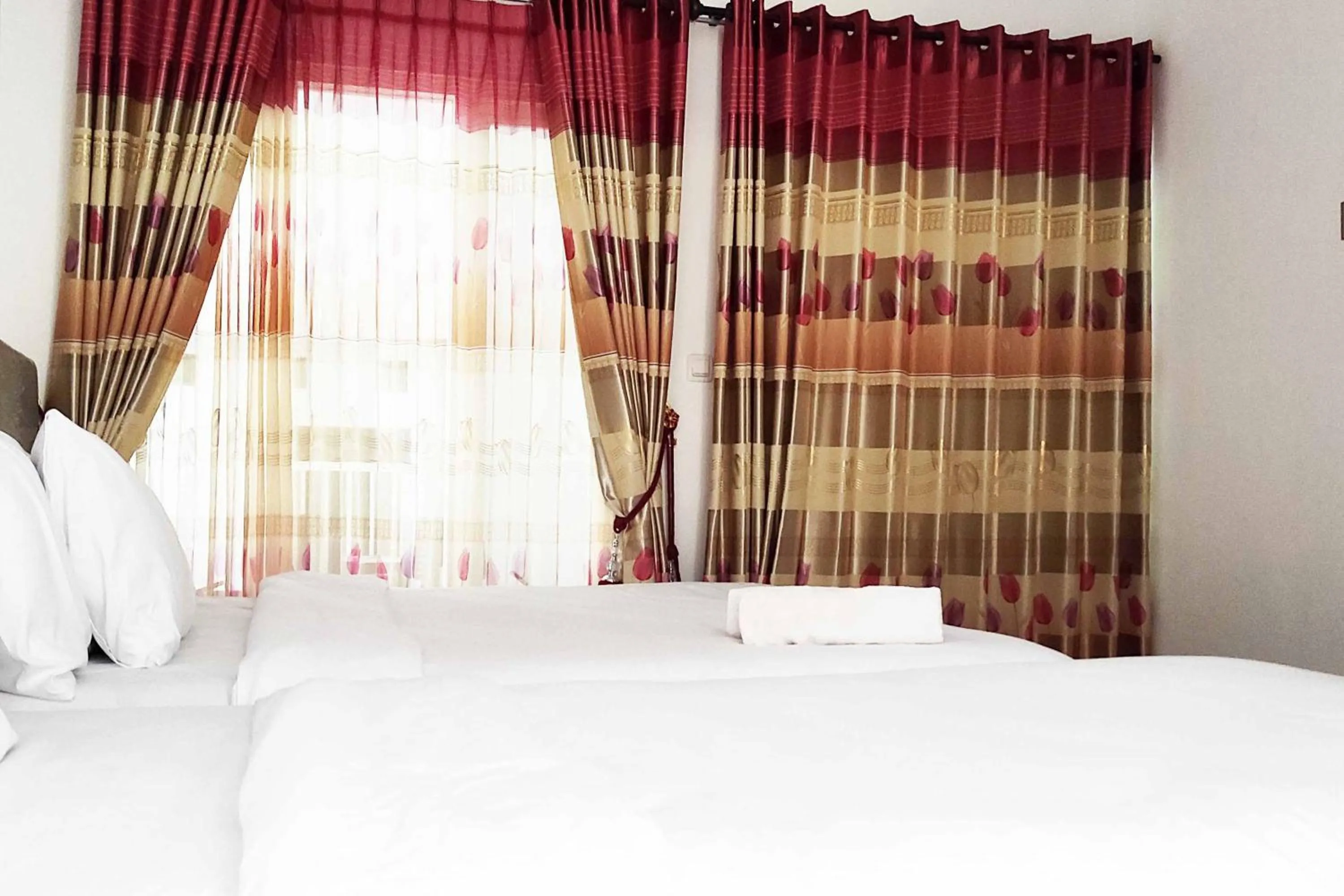 Bed in Pertiwi Homestay Near Museum Angkut Batu Mitra RedDoorz