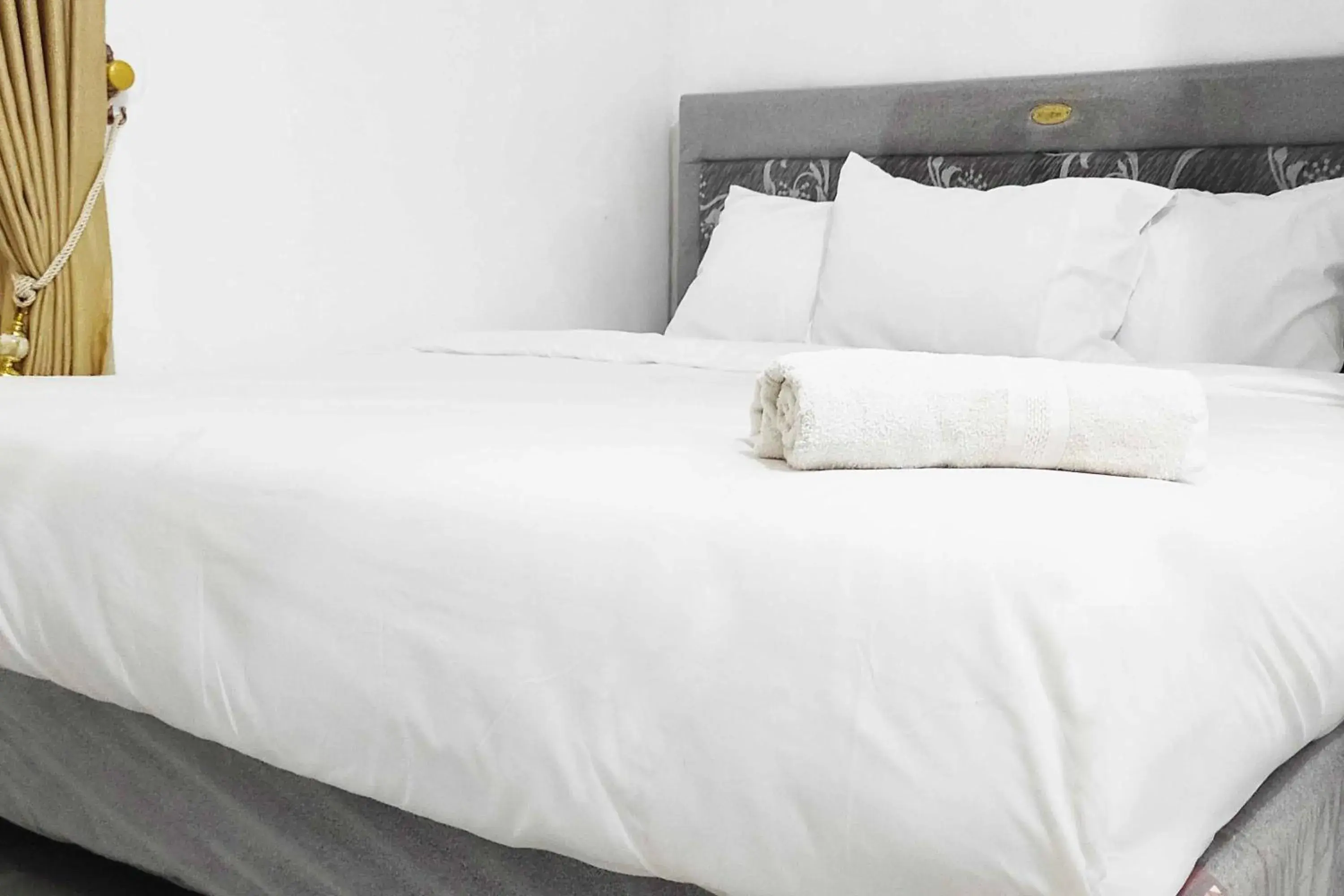 Bed in Pertiwi Homestay Near Museum Angkut Batu Mitra RedDoorz Bed in Pertiwi Homestay Near Museum Angkut Batu Mitra RedDoorz