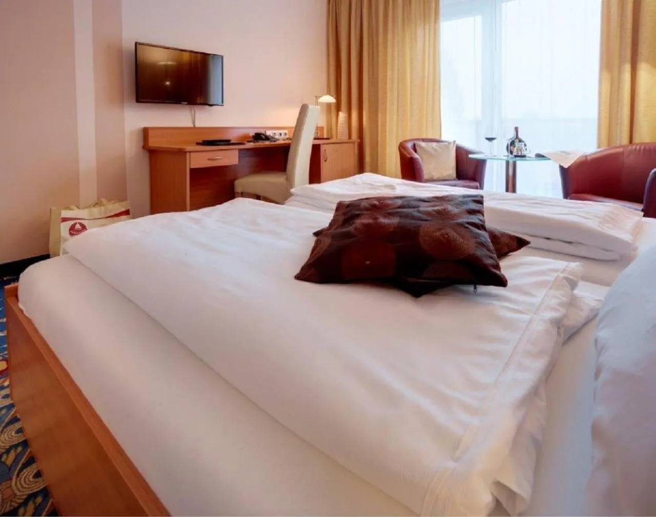 Photo of the whole room, Bed in Kurhotel Pyramide Bad Windsheim