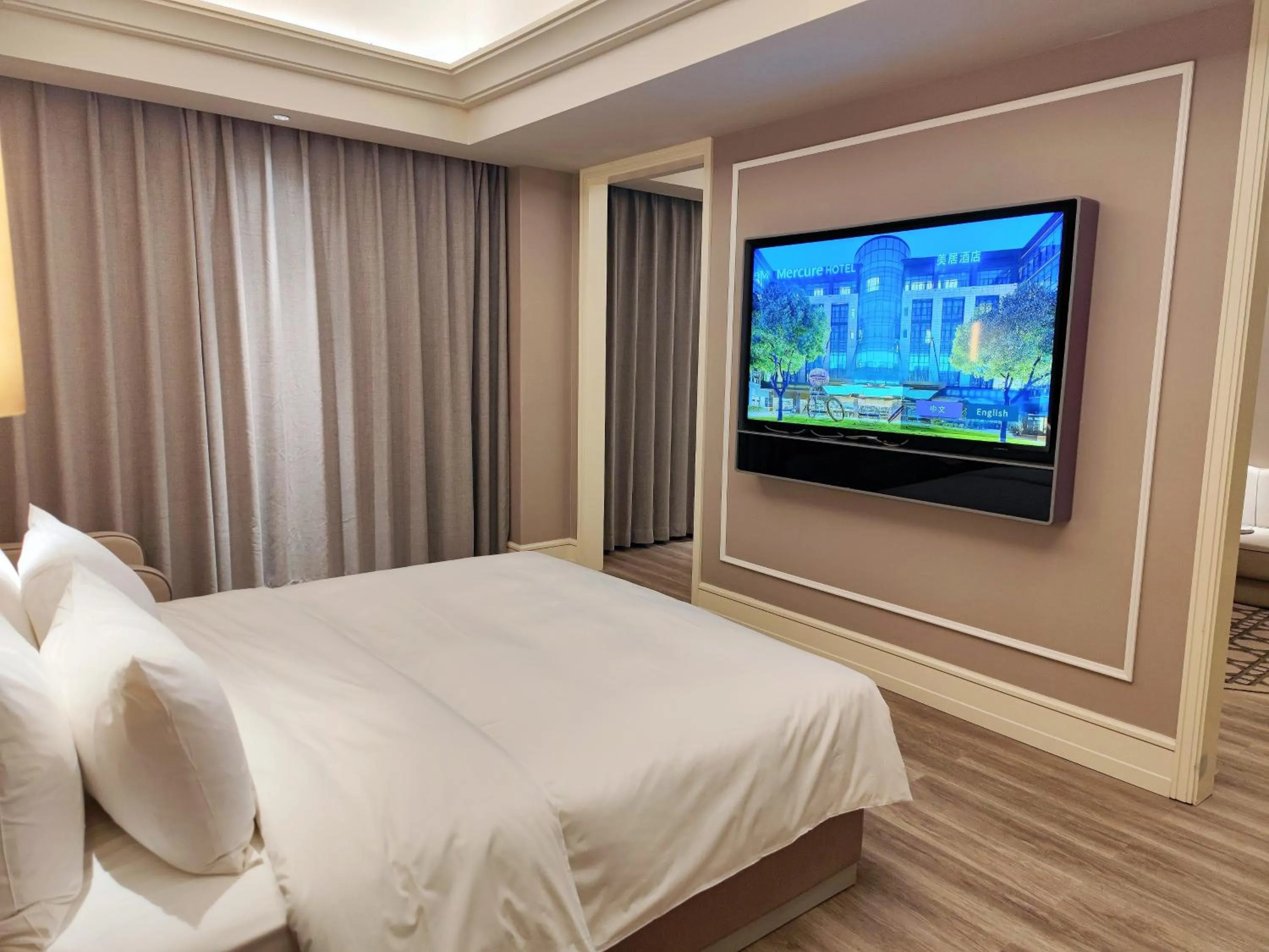 Communal lounge/ TV room, Bed in Mercure Anyang Downtown