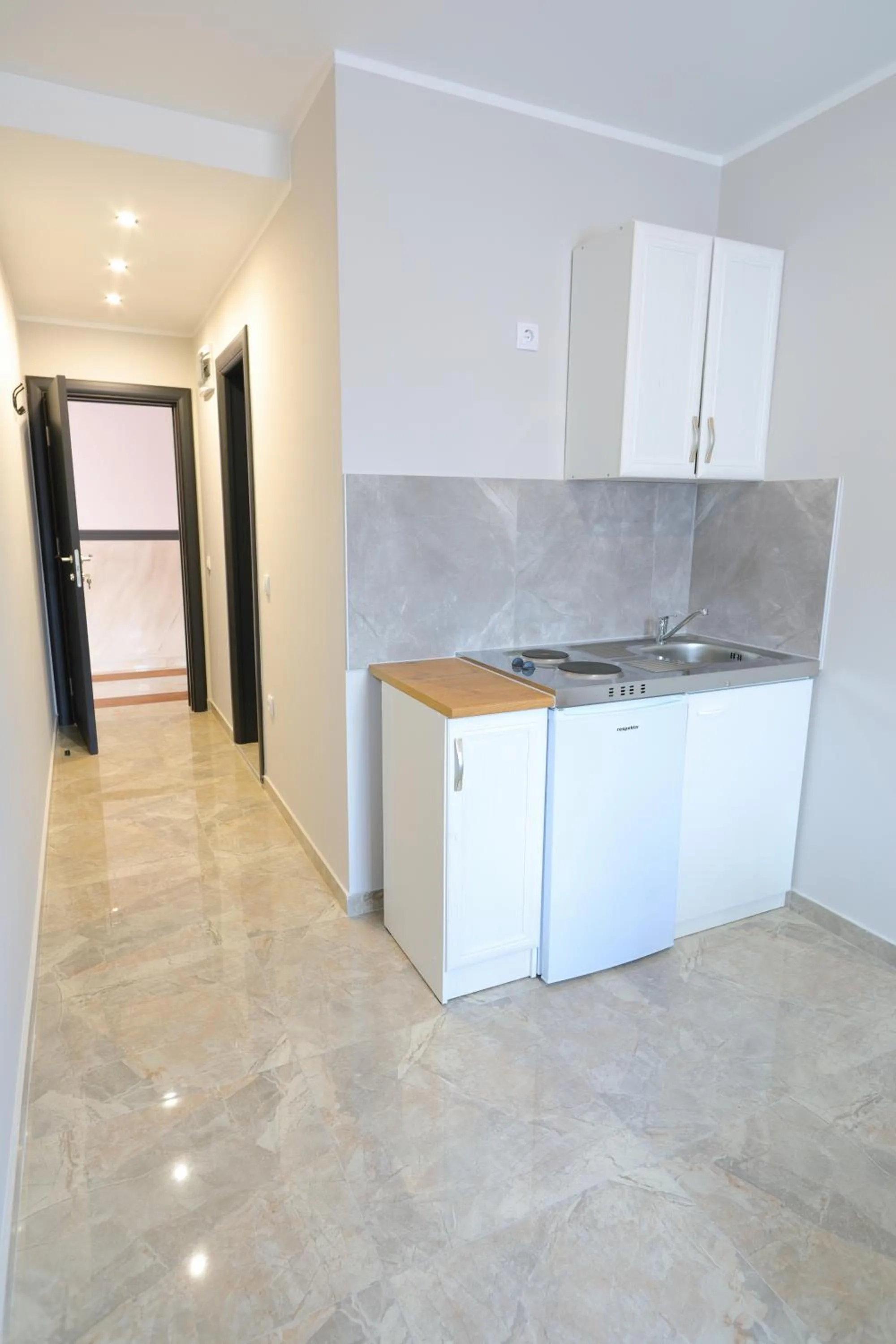 Kitchen or kitchenette in Fenix Apartments