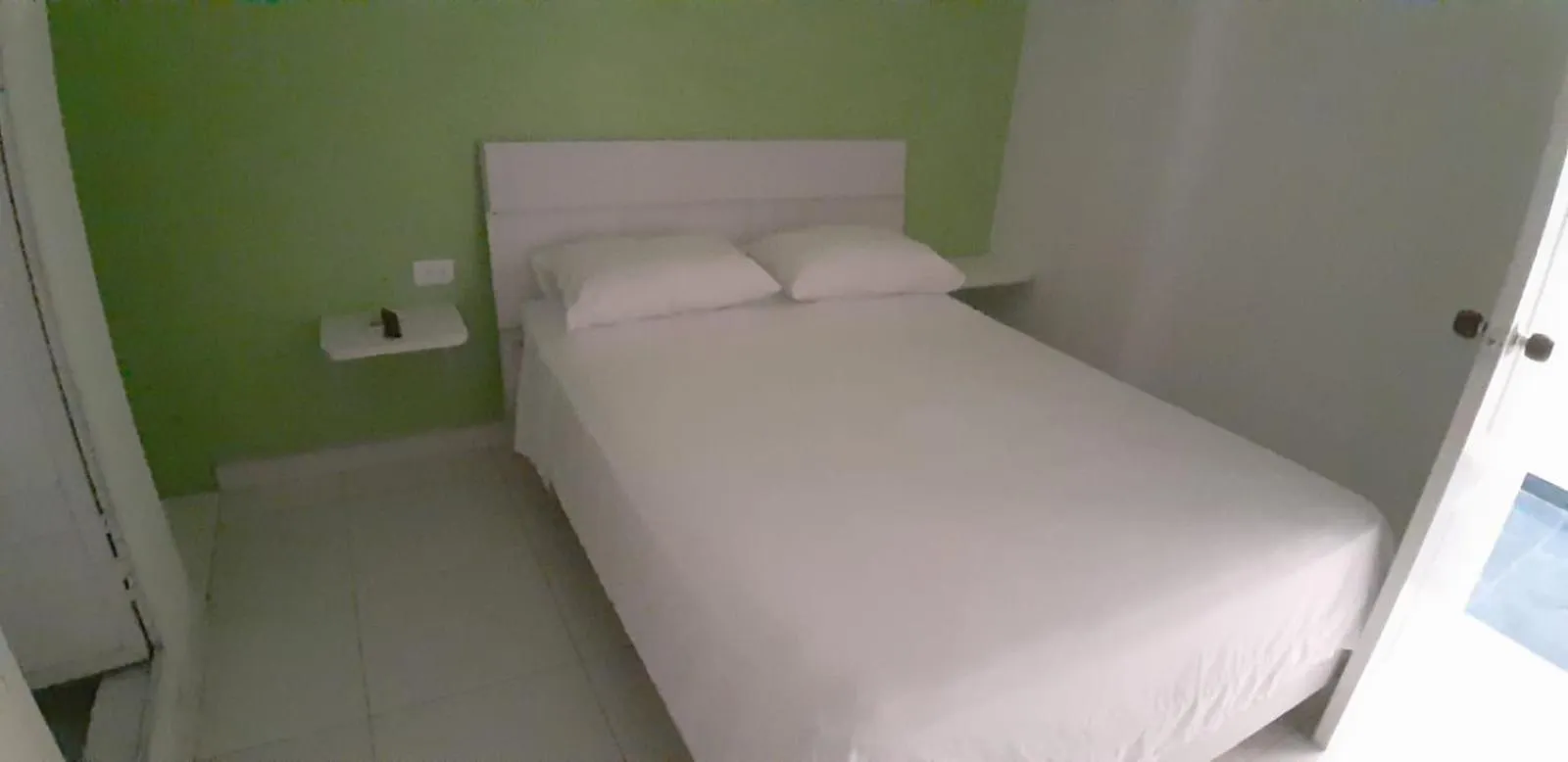 Bed in Tita’s Airport Hotel