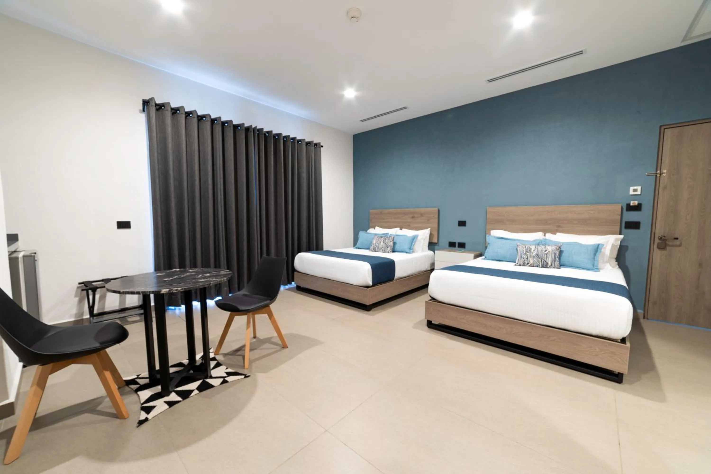 Photo of the whole room, Bed in TH HOTEL & VIVIENDA