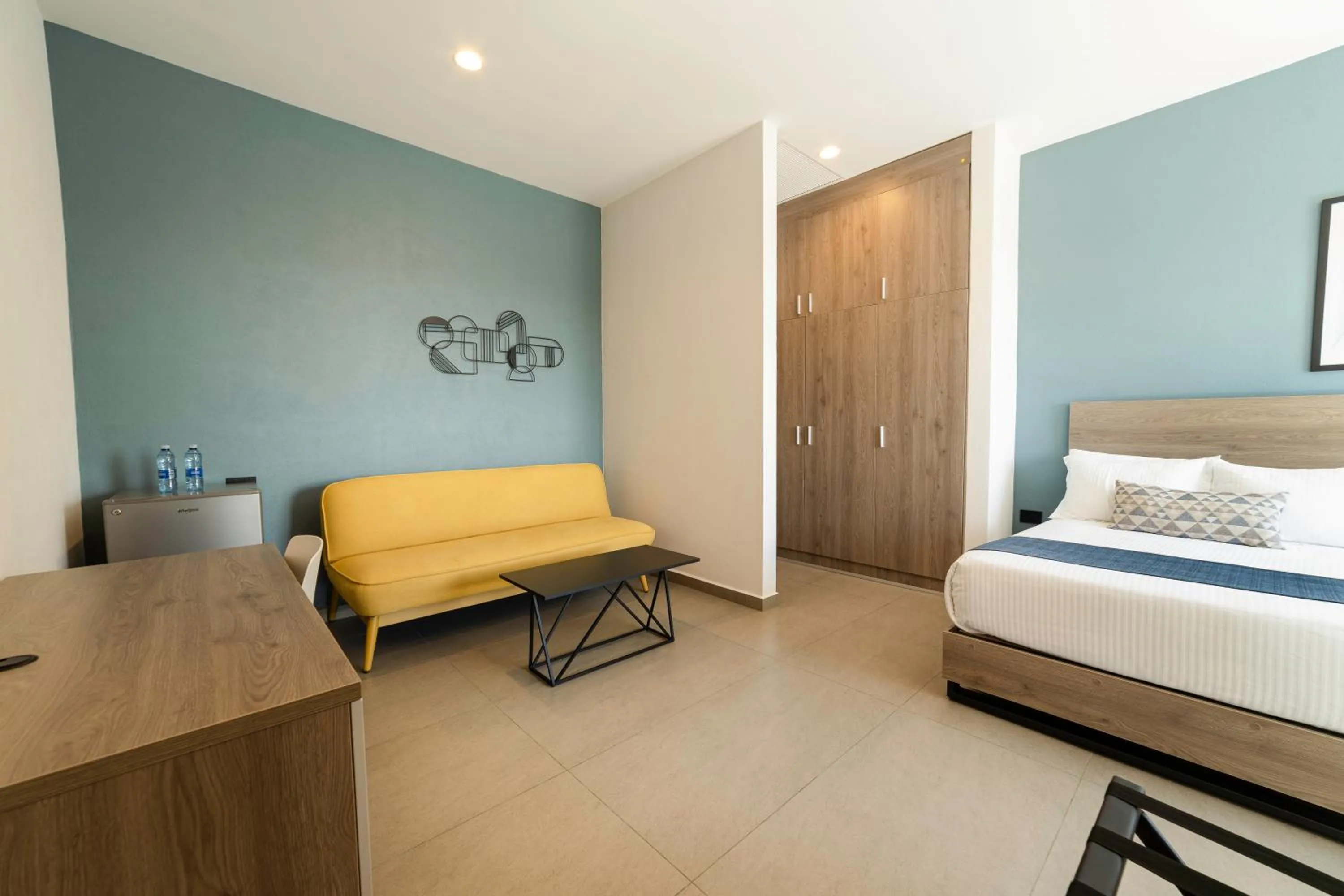 Seating area, Bed in TH HOTEL & VIVIENDA