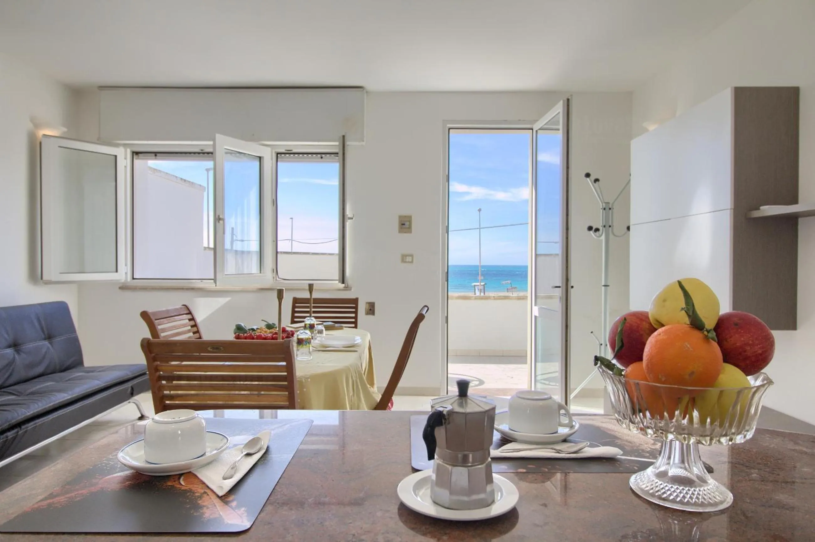 Living room in Front Beach Torre Mozza by LoveSud