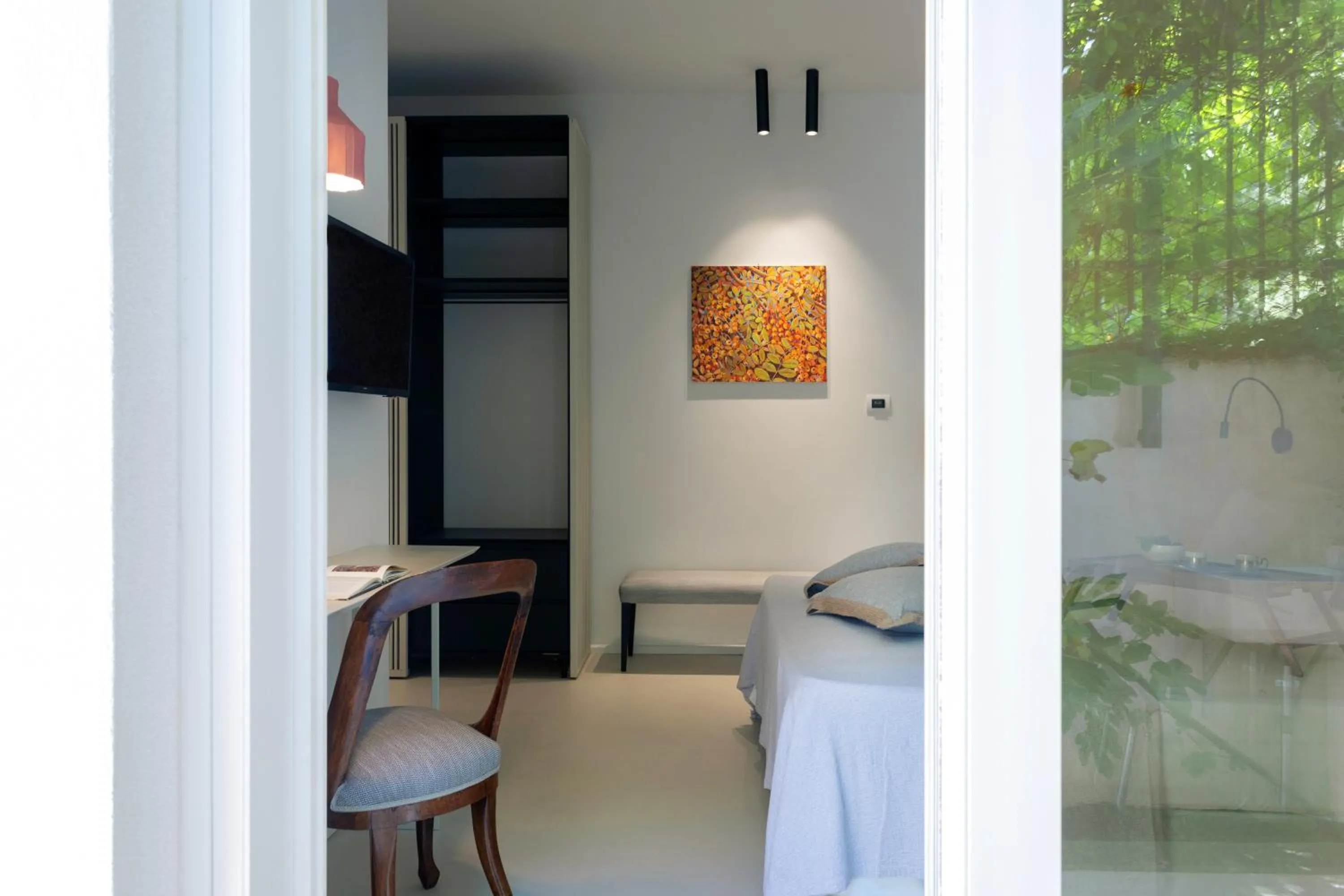 Bedroom in Domìa Boutique Hotel e Cucina