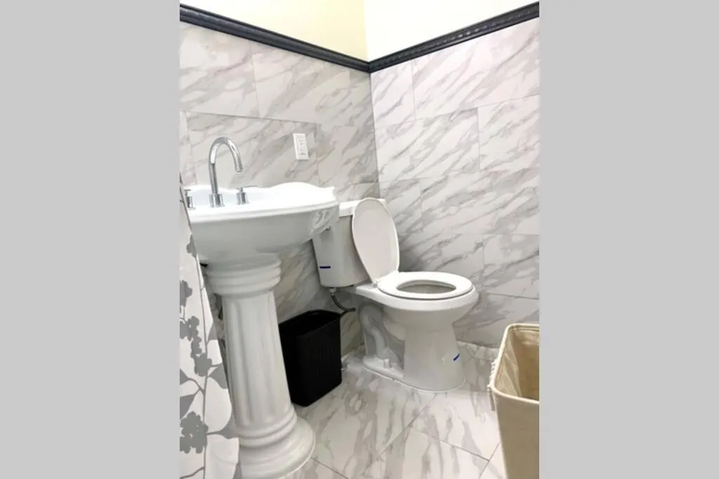 Bathroom in The Hennepin House- With Private Yard & Parking, Minutes From Falls & Casino by Niagara Hospitality