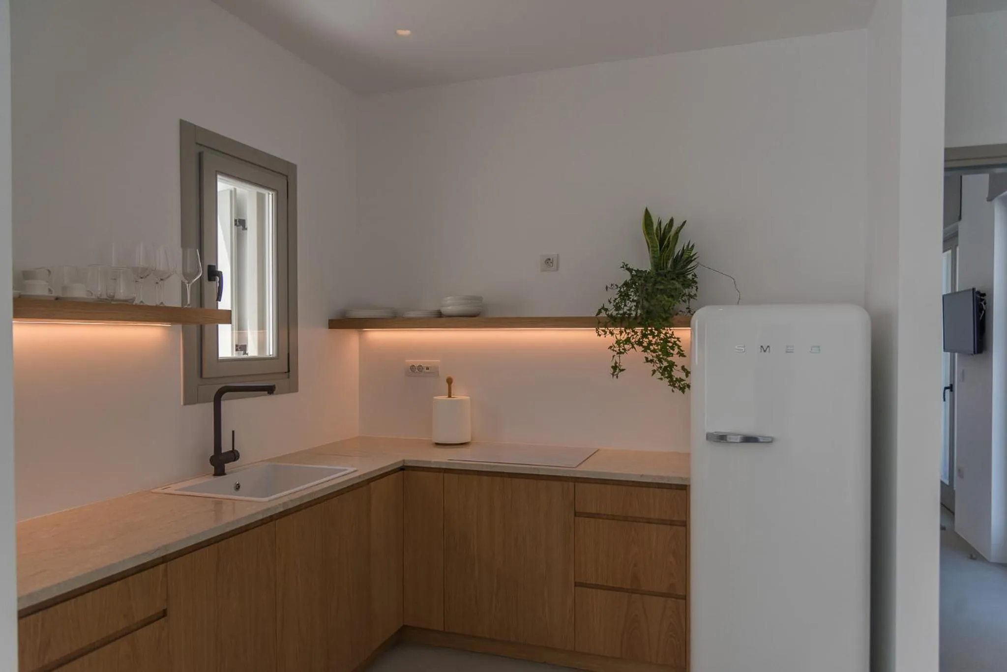 Kitchen or kitchenette in Amarelo Suites