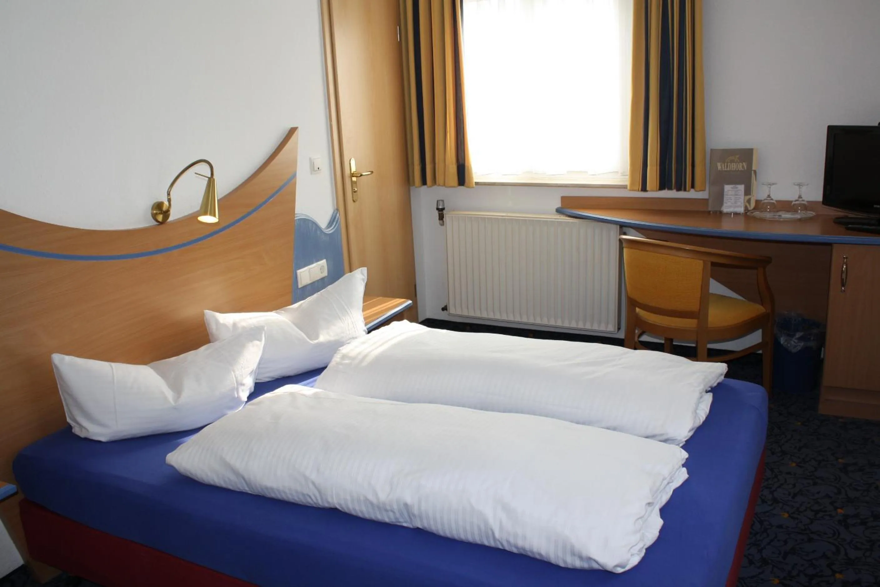 Photo of the whole room, Bed in Hotel Waldhorn