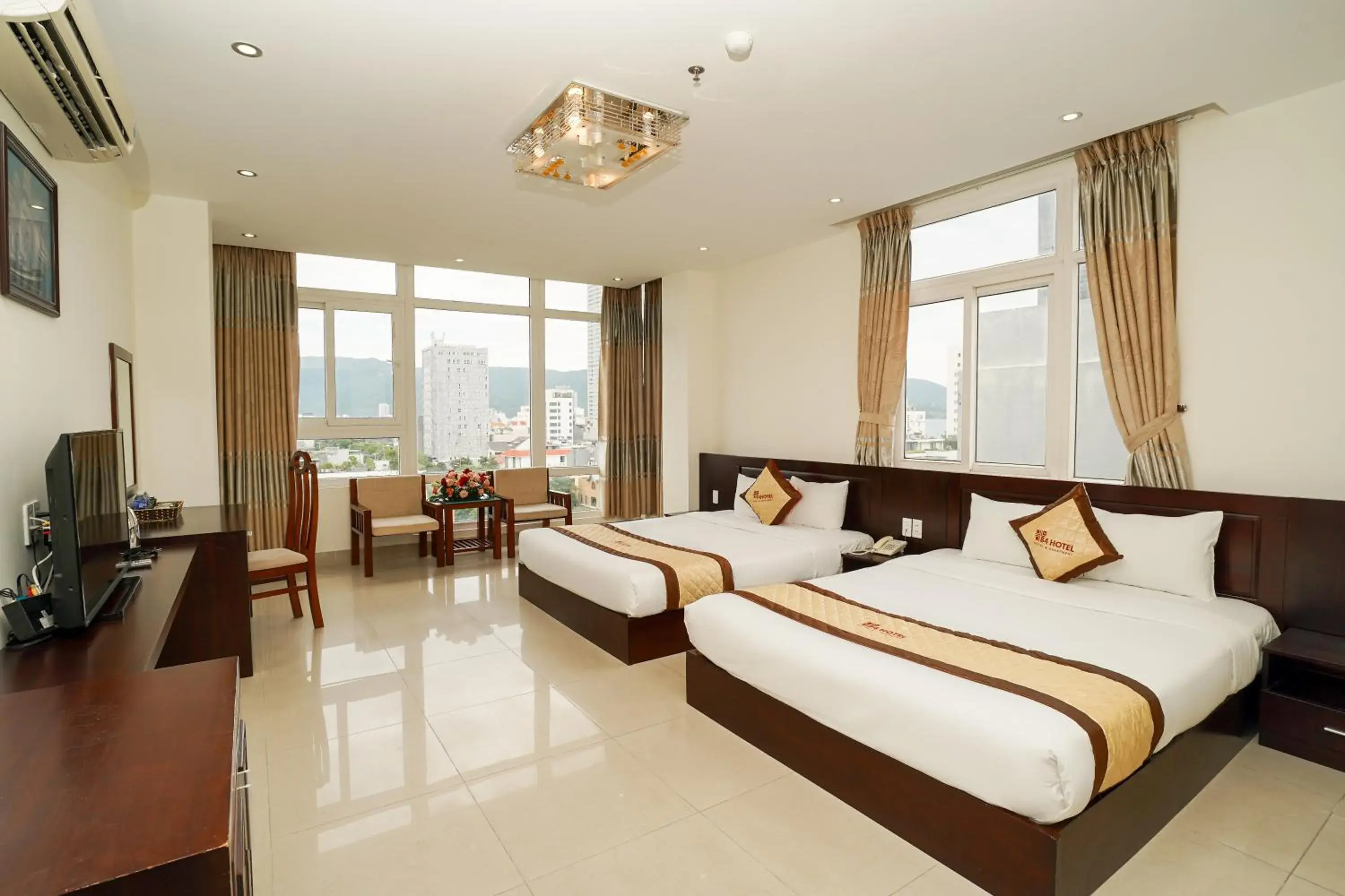Communal lounge/ TV room, Bed in Sunview Beach Hotel Danang Communal lounge/ TV room, Bed in Sunview Beach Hotel Danang